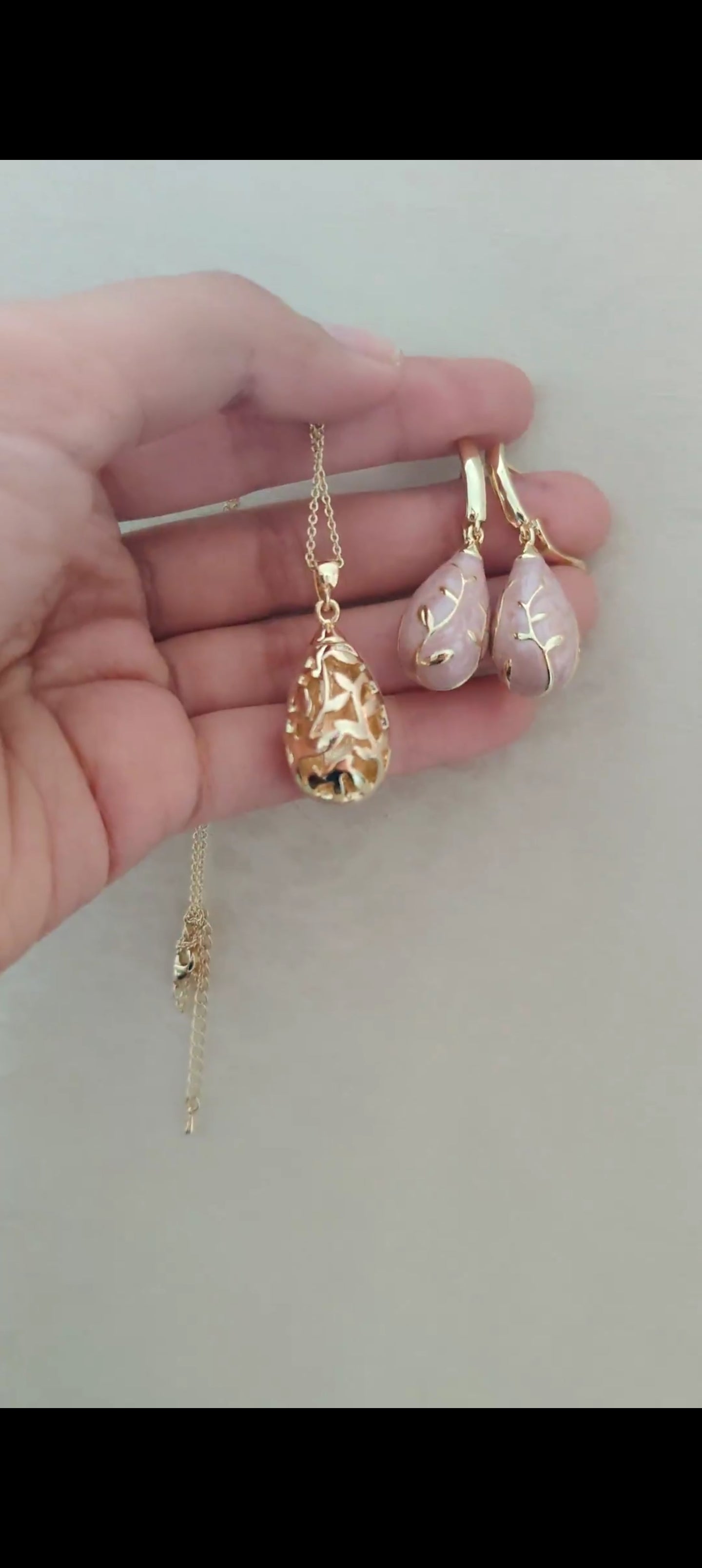 Chitrita Pendant set with pink enamel and gold work