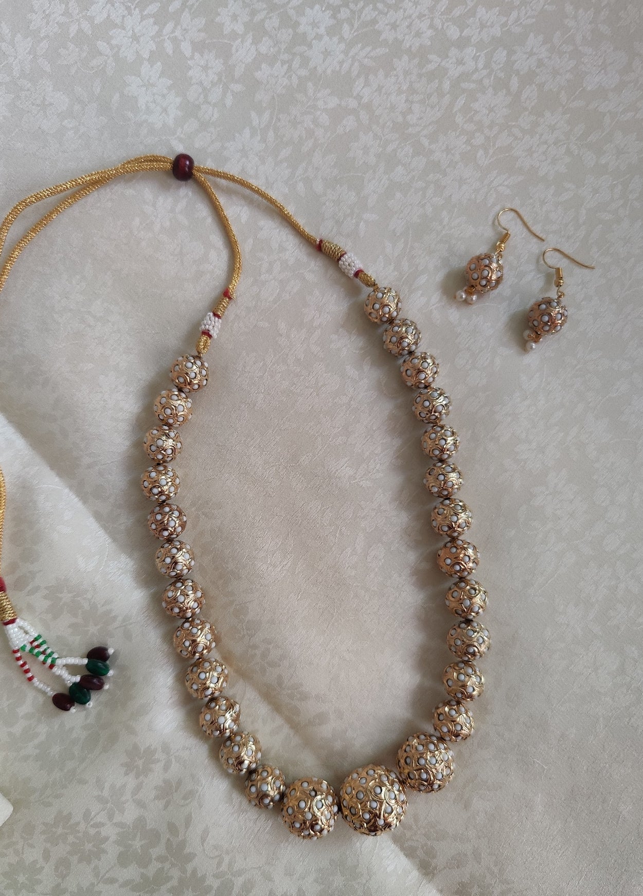 Deepamala set with golden beads with embedded pearls