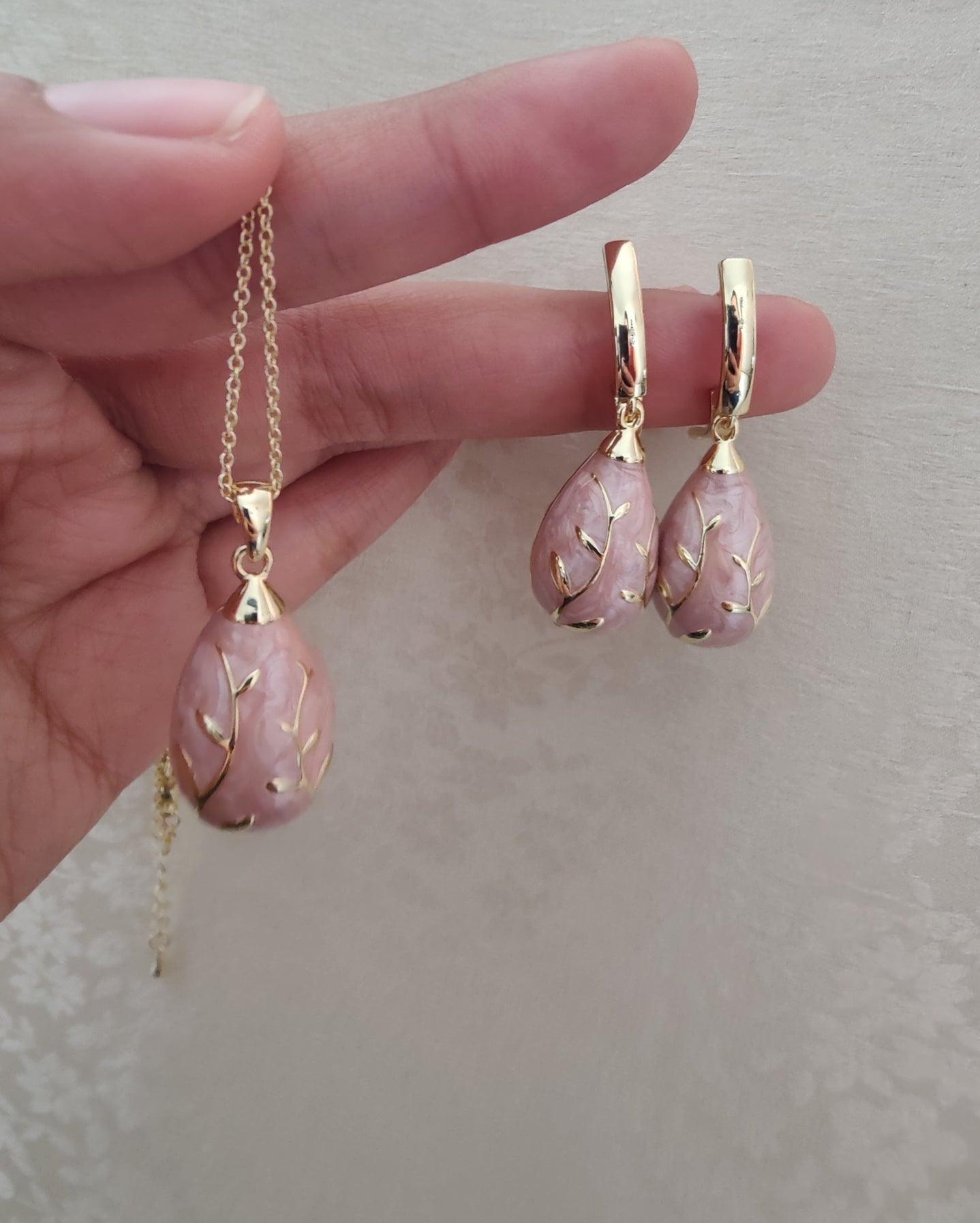 Chitrita Pendant set with pink enamel and gold work