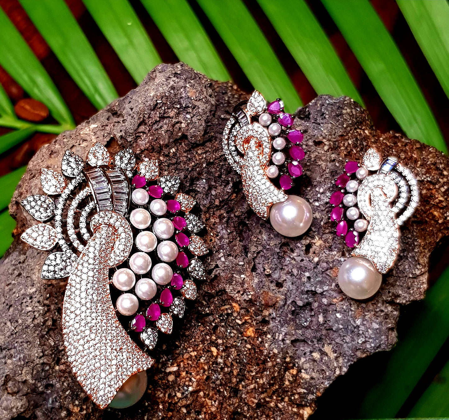 Gorgeous pendant set in antique finish, mayur influence with red stone, pearls and CZ, matching earrings