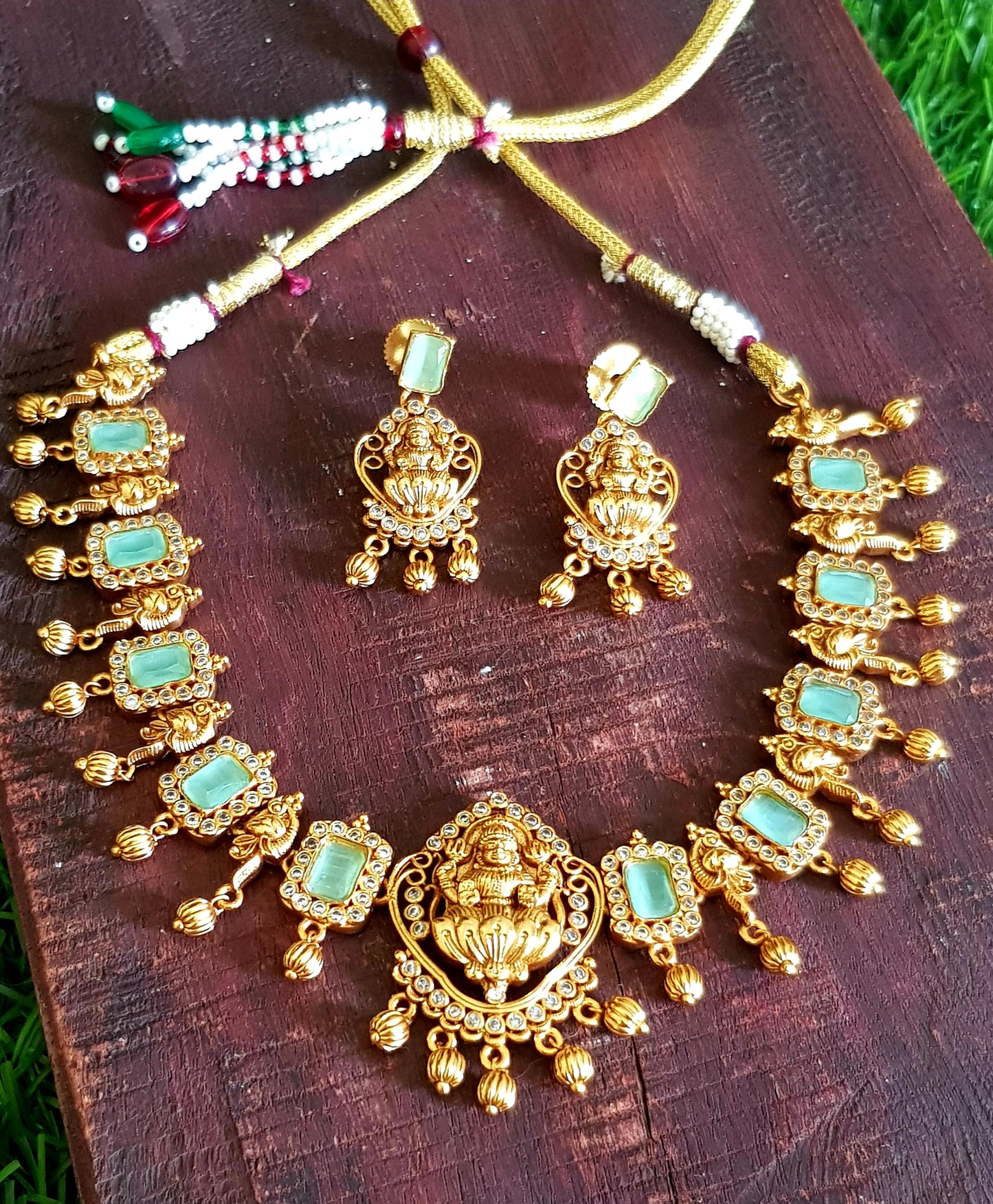 Temple jewelry set, necklace with Goddess Lakshmi motif, mint green and clear stones detailing , matching earrings