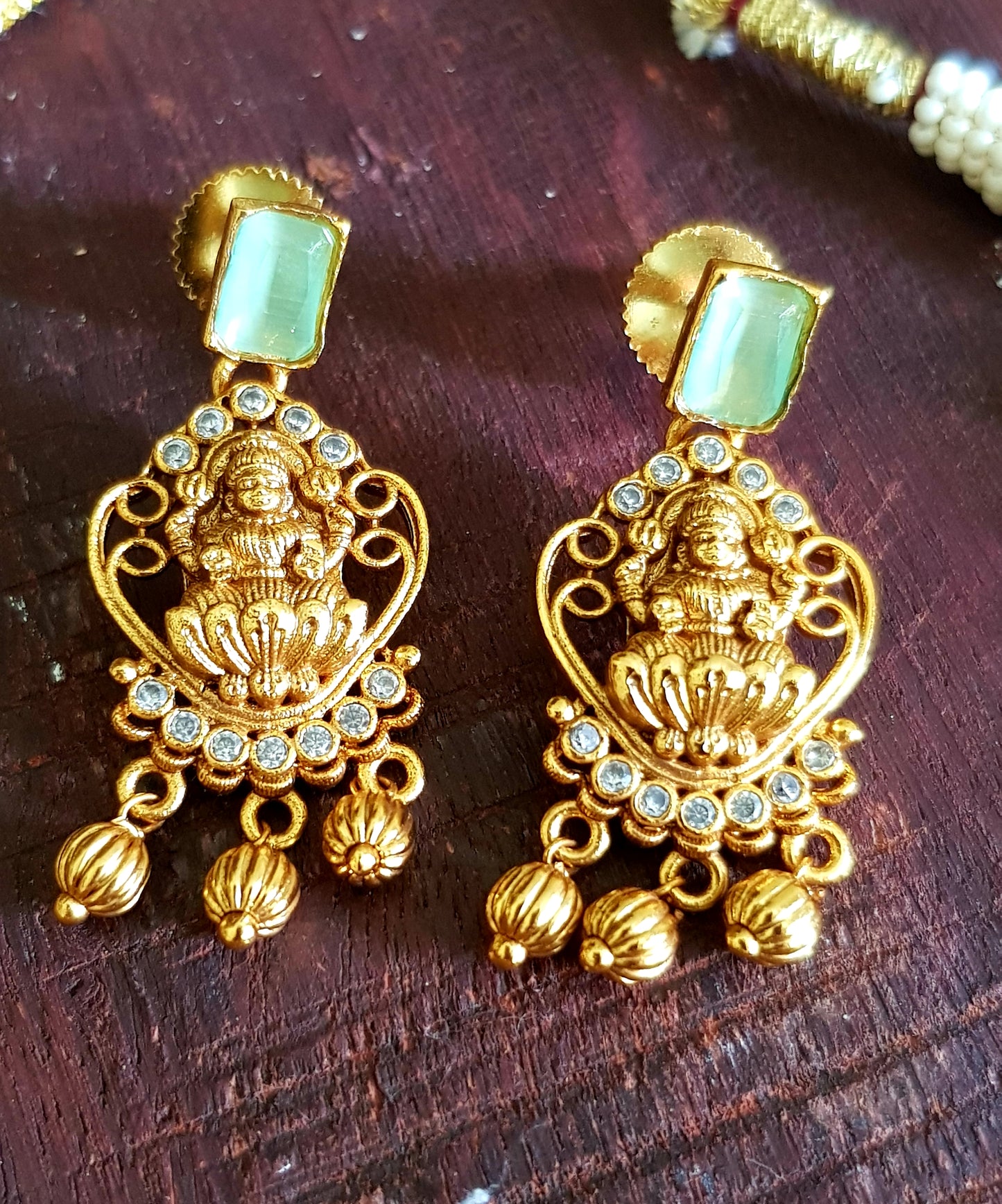 Temple jewelry set, necklace with Goddess Lakshmi motif, mint green and clear stones detailing , matching earrings