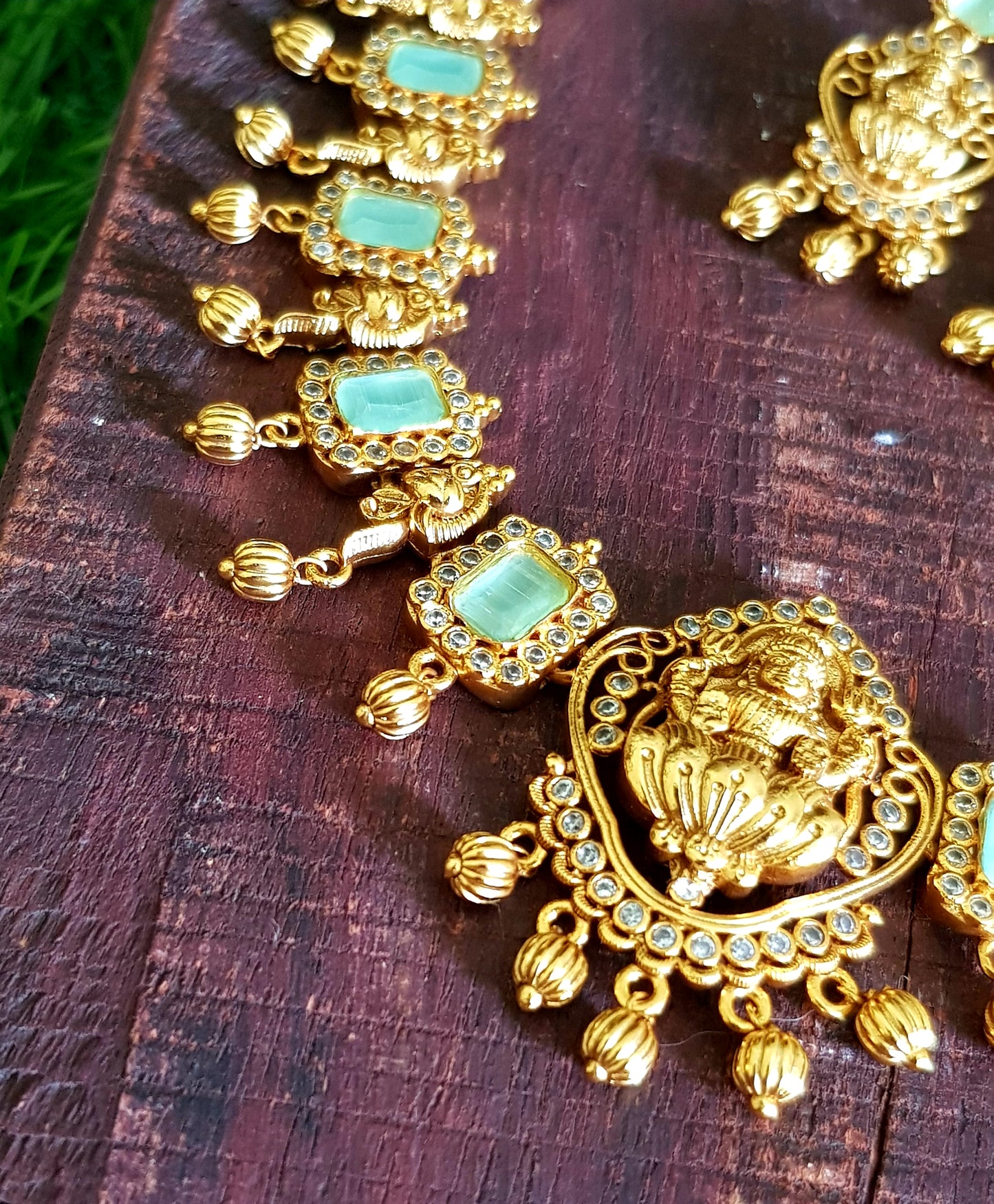 Temple jewelry set, necklace with Goddess Lakshmi motif, mint green and clear stones detailing , matching earrings