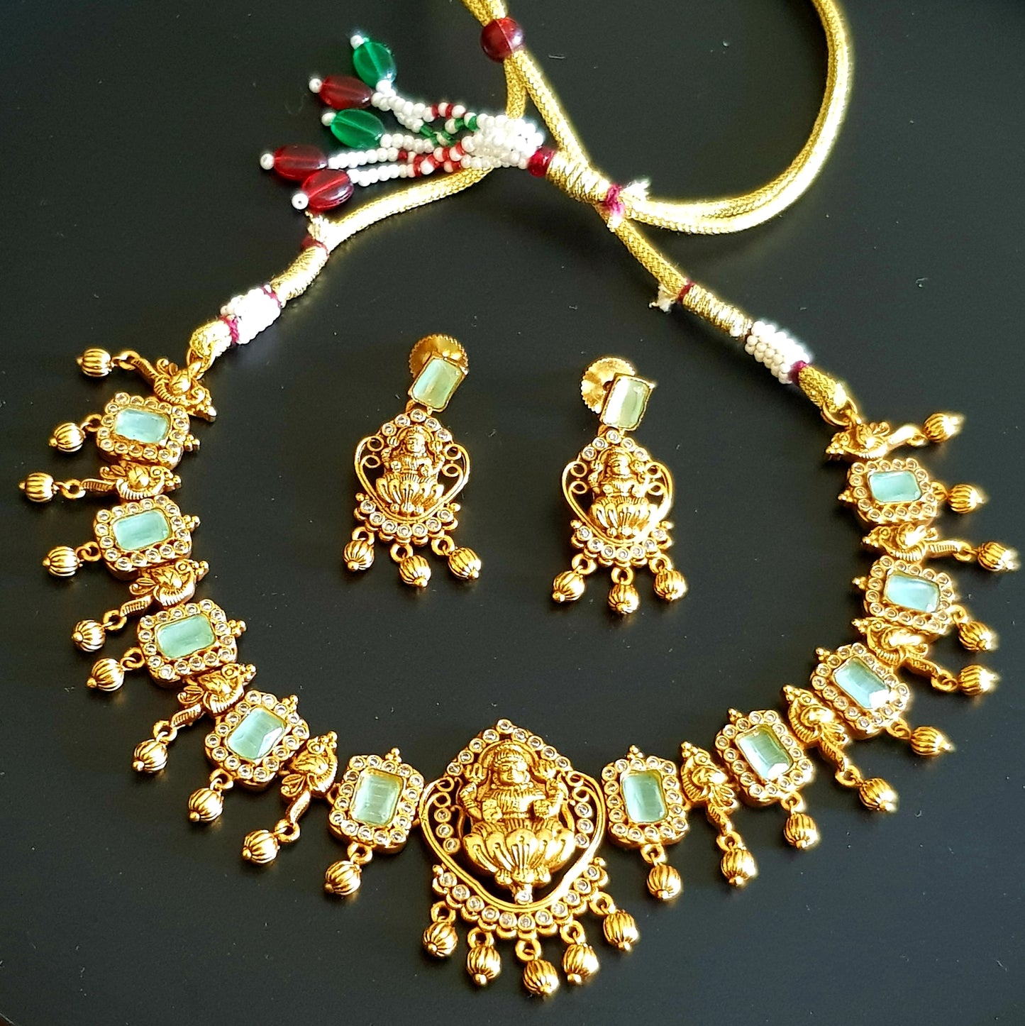 Temple jewelry set, necklace with Goddess Lakshmi motif, mint green and clear stones detailing , matching earrings