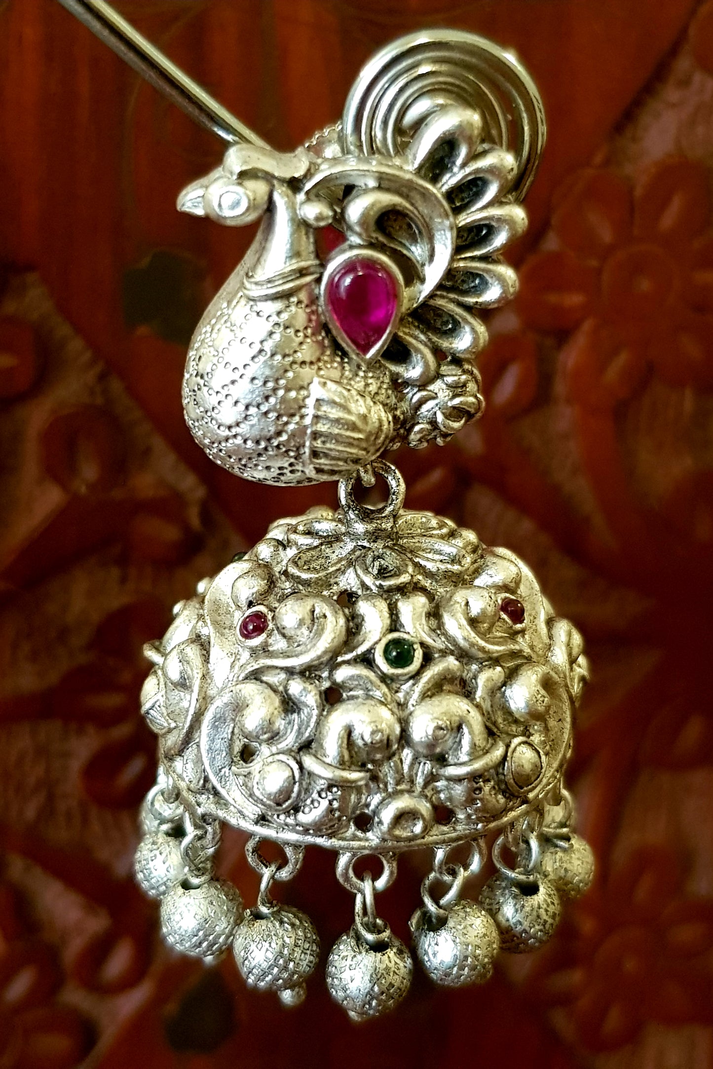 Silver finish temple jewelry set, necklace with peacock motif, green-red stones inlay, matching jhumkas (earrings)