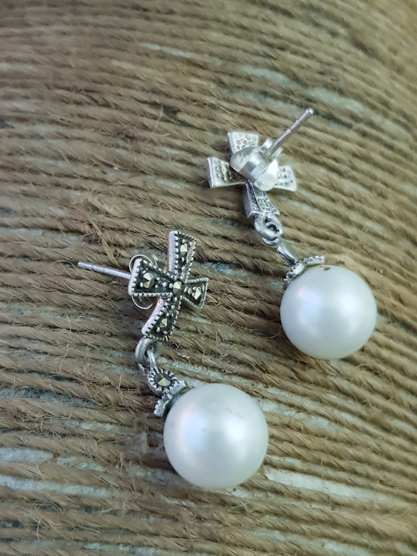 Silver earrings, hanging pearl on cross shaped marcasite studs