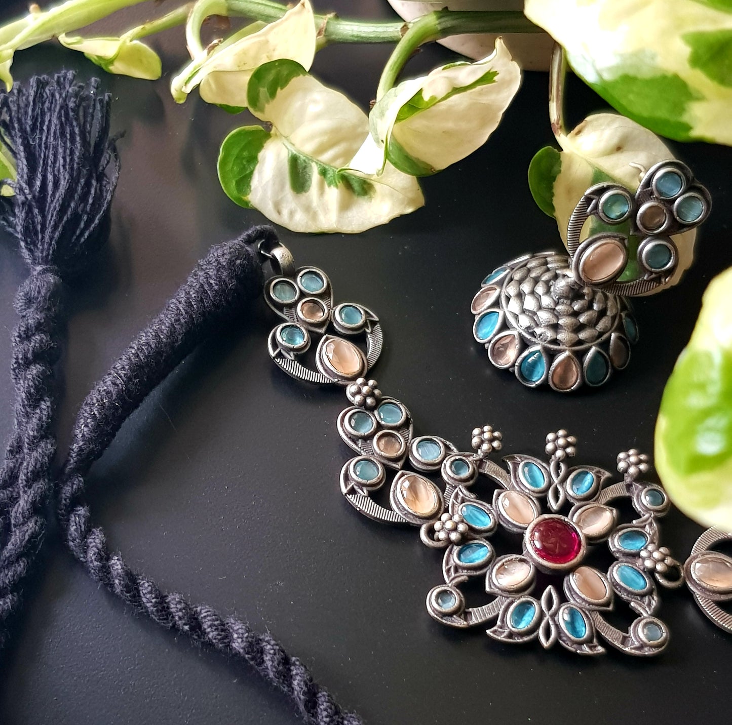 Antique silver finish choker set with pale peach, pale blue stone, matching jhumka (earrings)