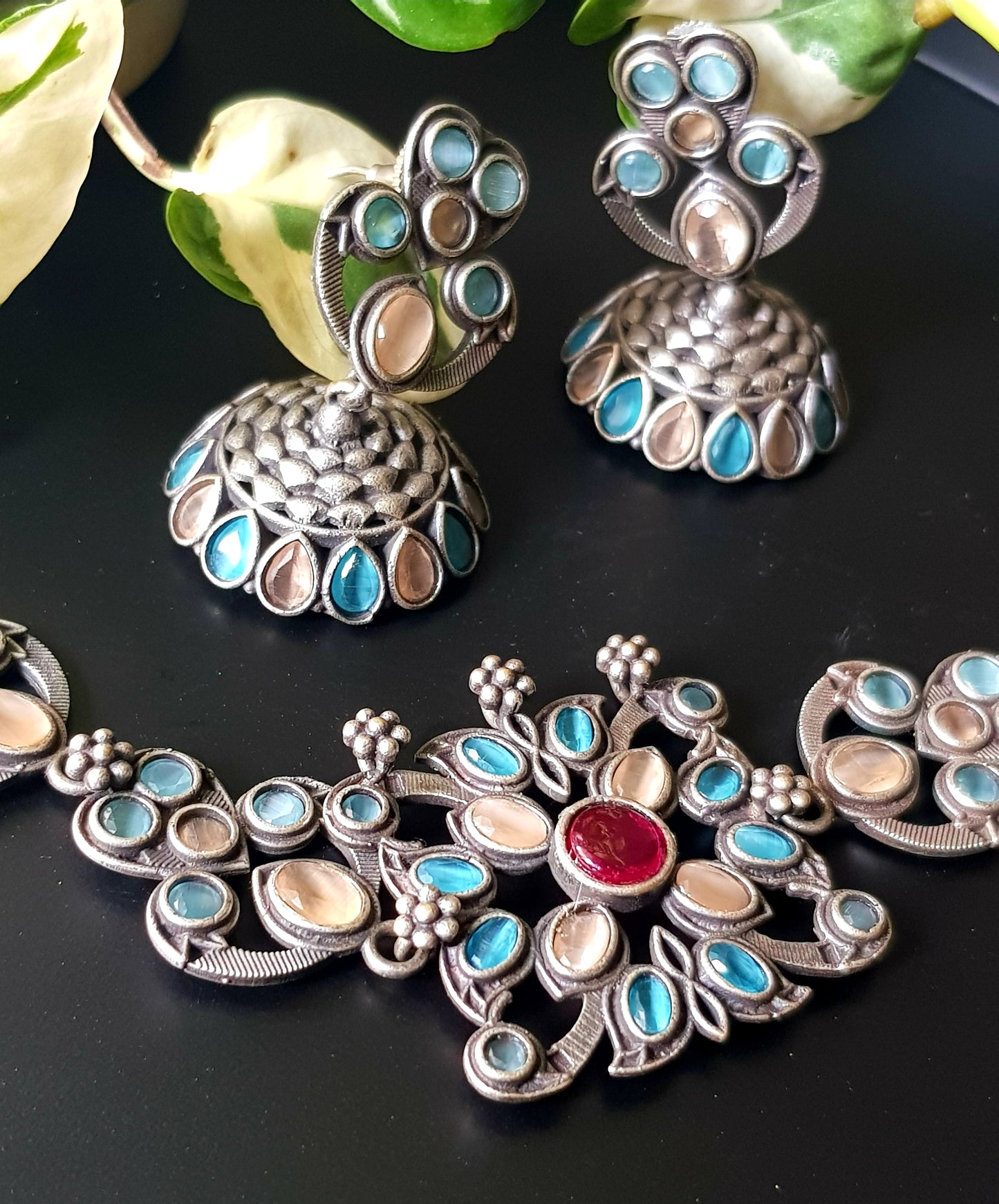 Antique silver finish choker set with pale peach, pale blue stone, matching jhumka (earrings)