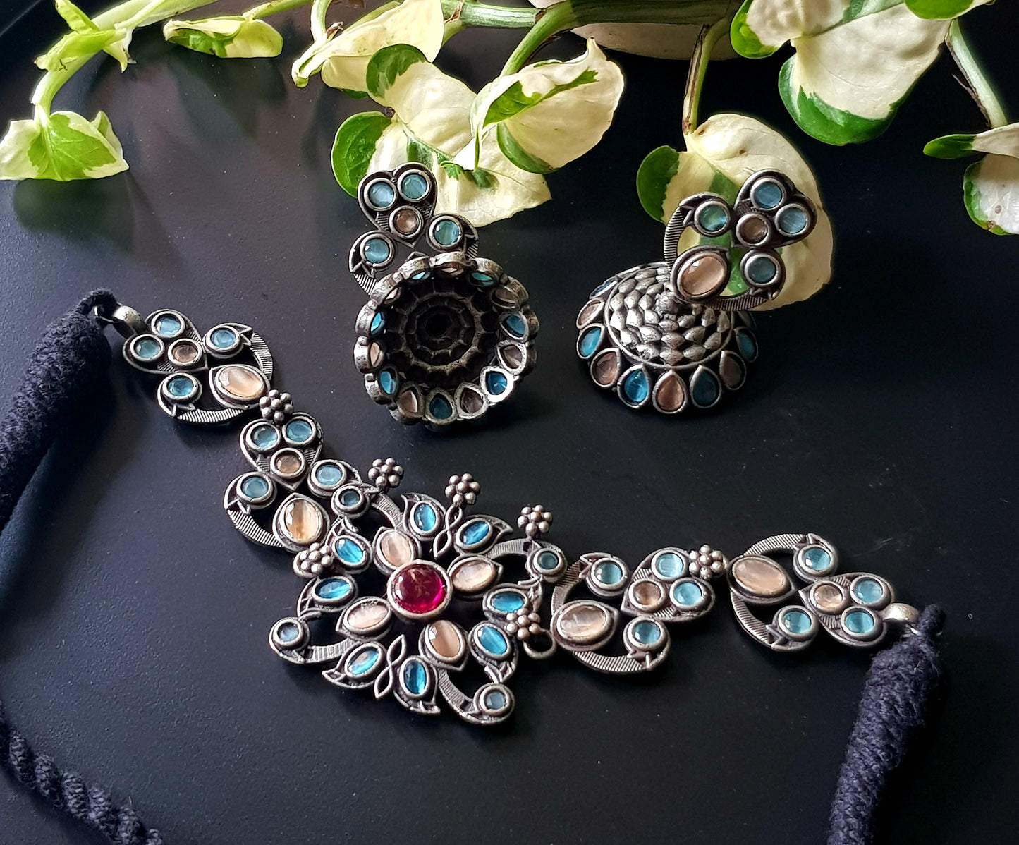 Antique silver finish choker set with pale peach, pale blue stone, matching jhumka (earrings)