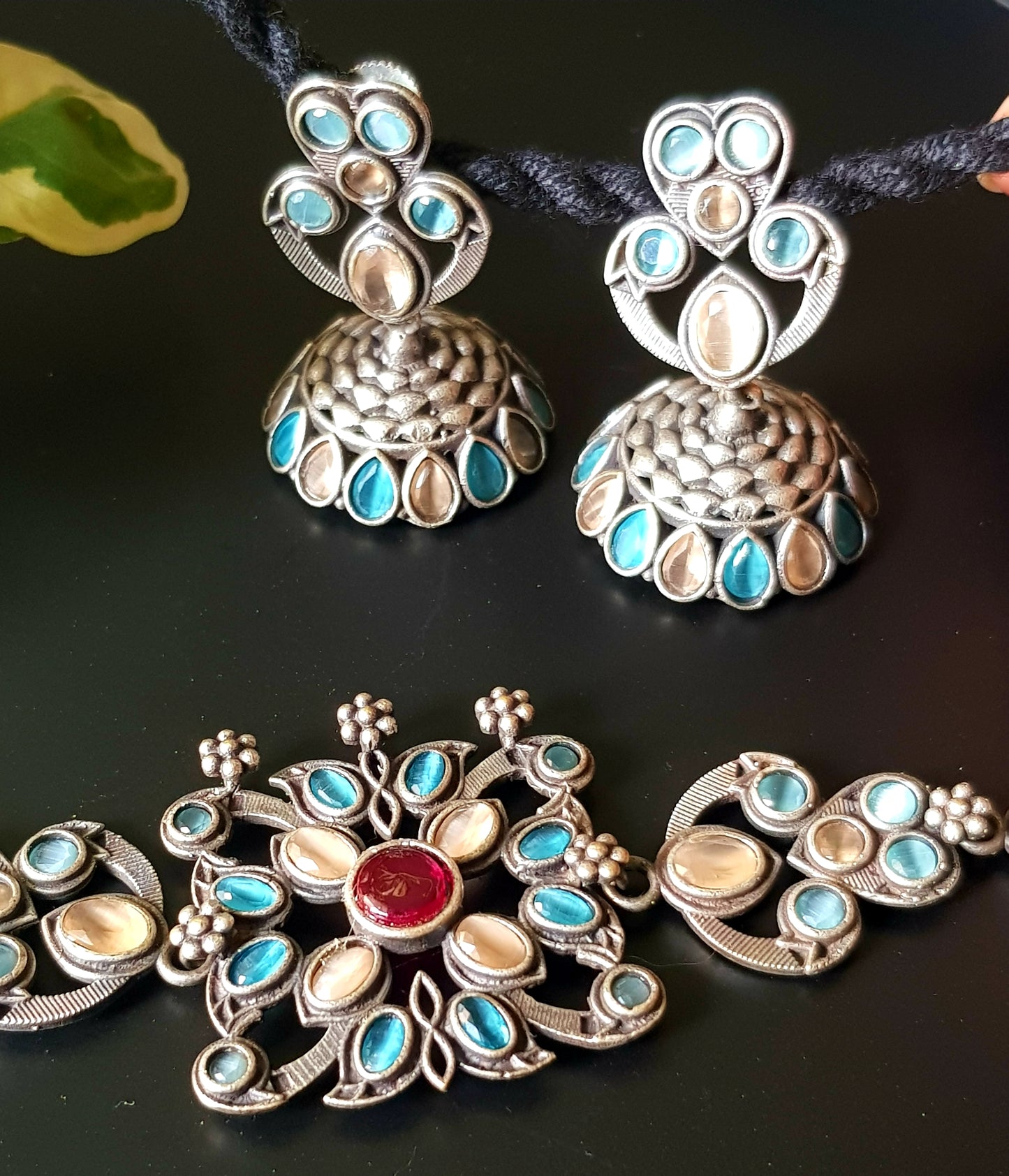 Antique silver finish choker set with pale peach, pale blue stone, matching jhumka (earrings)