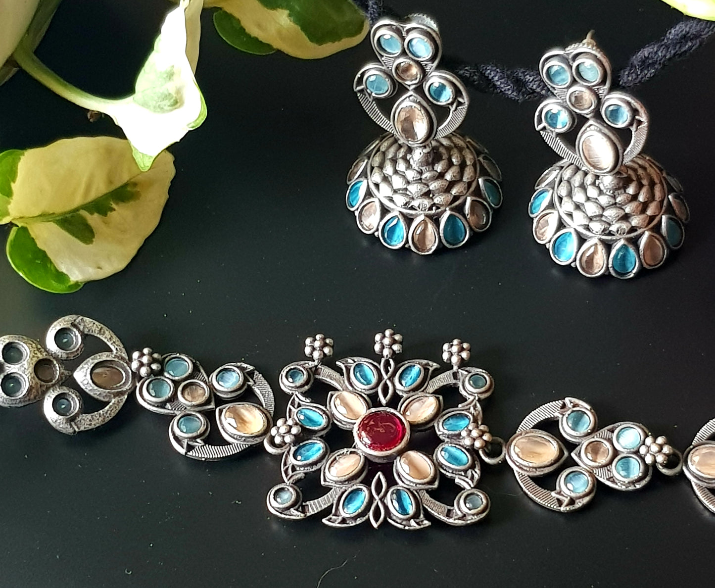 Antique silver finish choker set with pale peach, pale blue stone, matching jhumka (earrings)