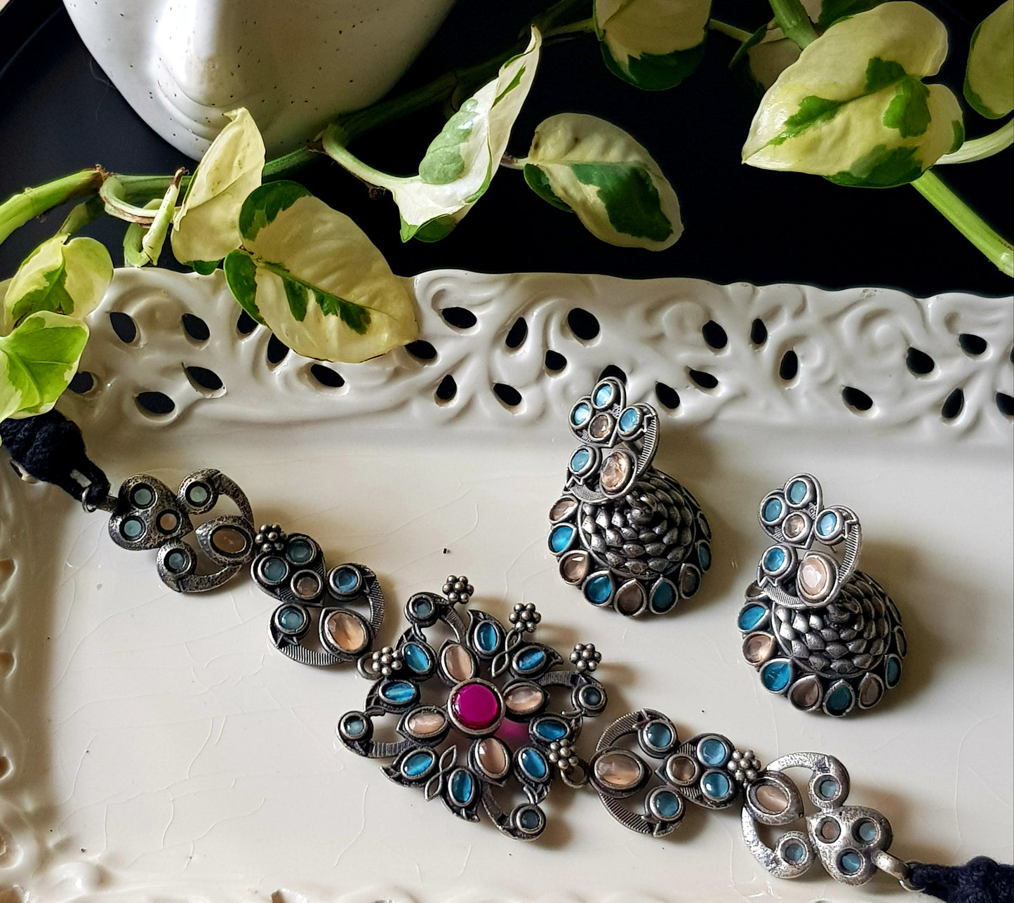 Antique silver finish choker set with pale peach, pale blue stone, matching jhumka (earrings)