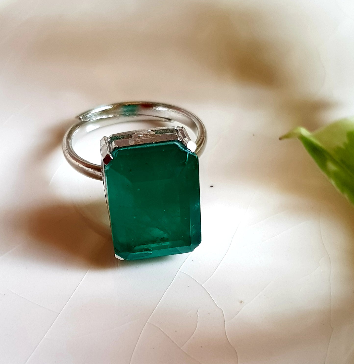 Platinum finish single stone emerald/topaz pendant set, matching ring and earrings