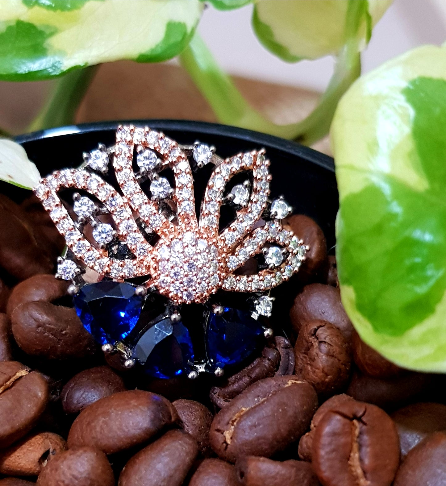 Antique rose gold finish ring with 3 triangular sapphire/emerald/ruby with CZ embellished flower pattern
