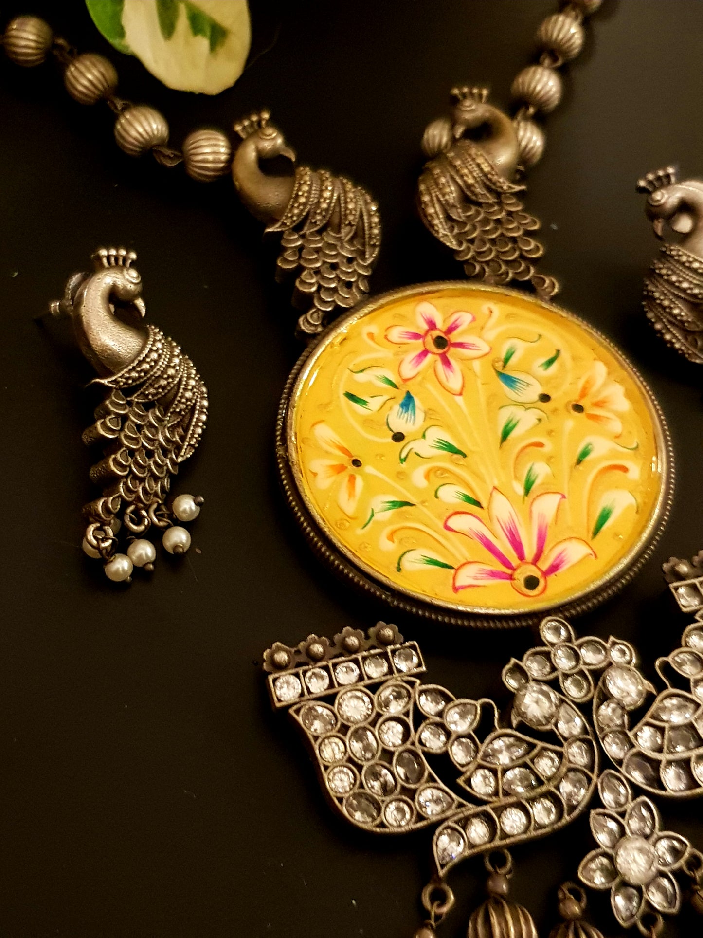 Silver finish hand-painted set with big yellow pendant and peacock motif , matching earrings