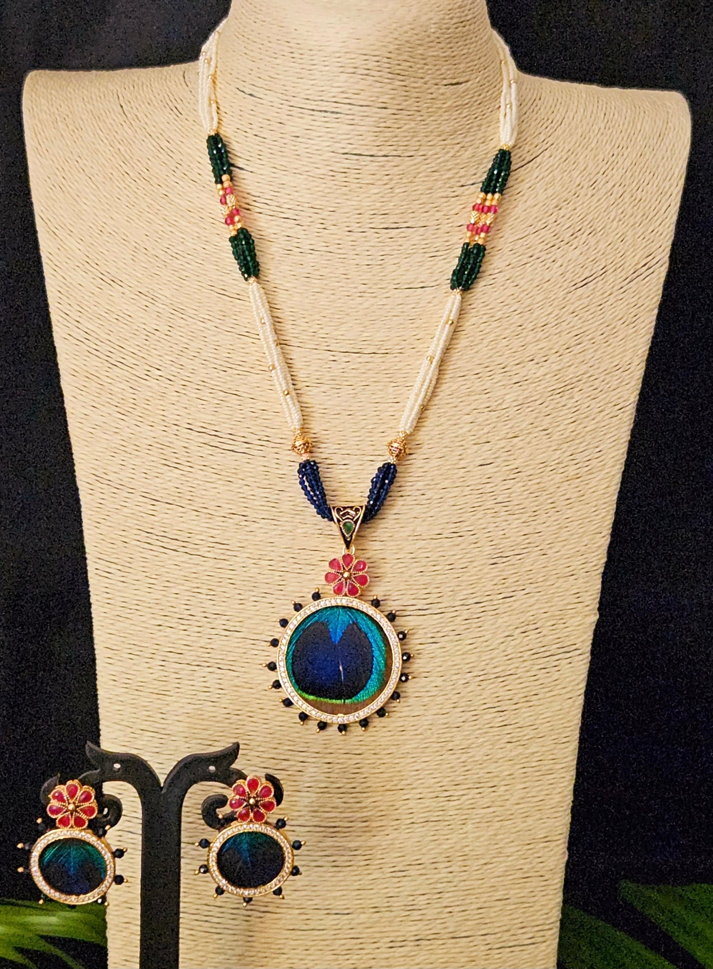 Pendant set with morpankh pendant framed with flower design in pearl and bead necklace, matching studs (earrings)
