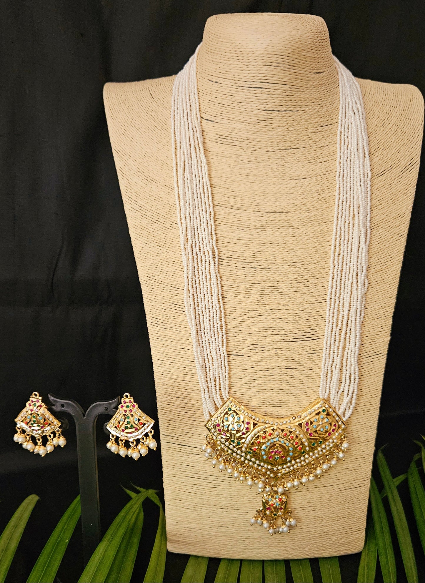 'Virtuous white' gold finish jadau set with navratan/pearl inlaid long necklace and matching earrings