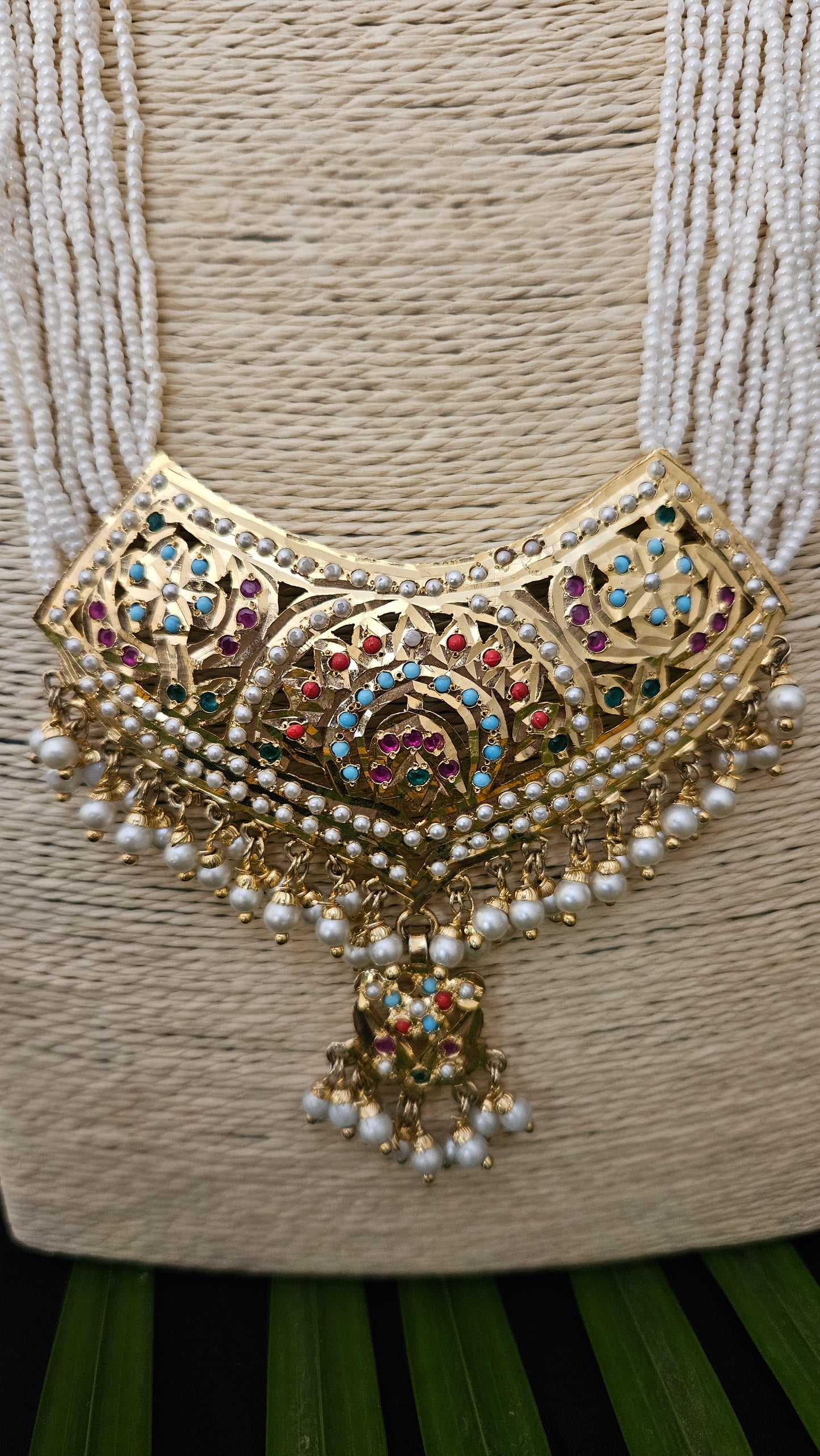 'Virtuous white' gold finish jadau set with navratan/pearl inlaid long necklace and matching earrings