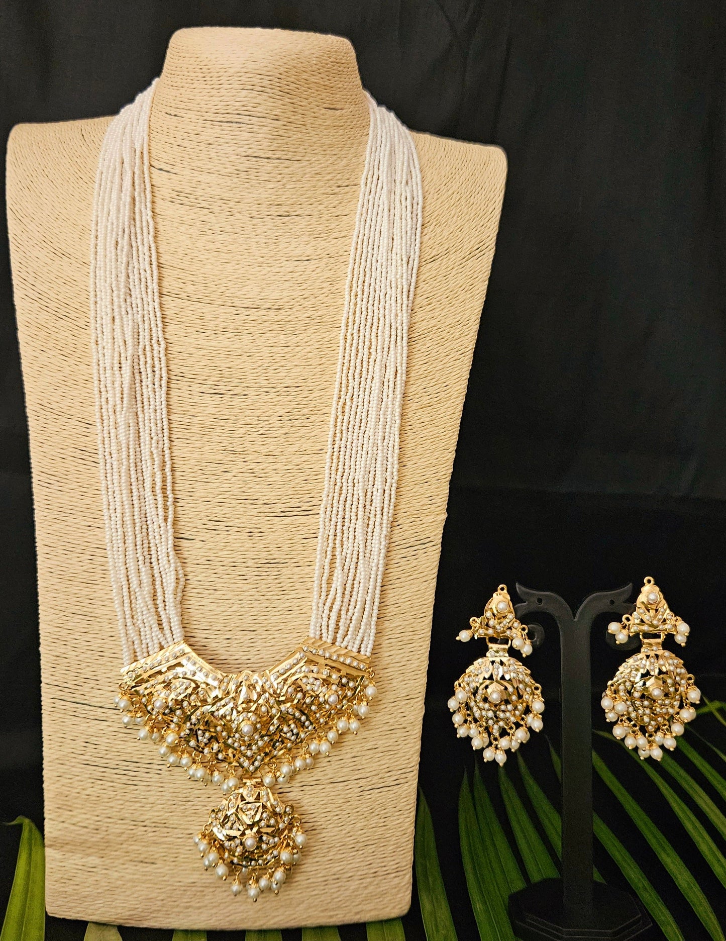 'Virtuous white' gold finish jadau set with navratan/pearl inlaid long necklace and matching earrings