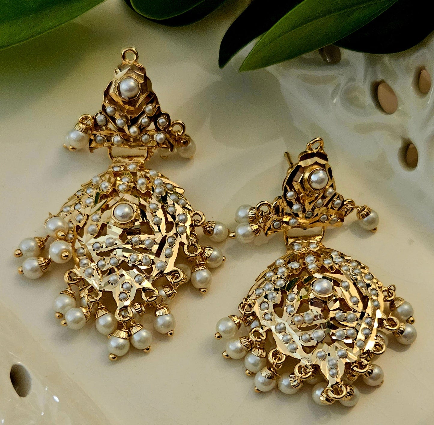 'Virtuous white' gold finish jadau set with navratan/pearl inlaid long necklace and matching earrings
