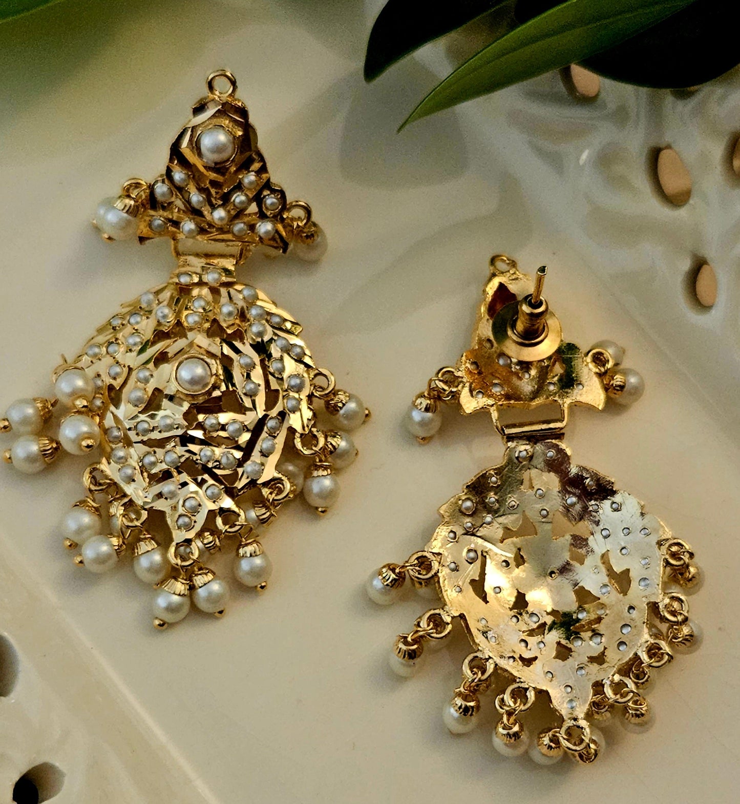 'Virtuous white' gold finish jadau set with navratan/pearl inlaid long necklace and matching earrings