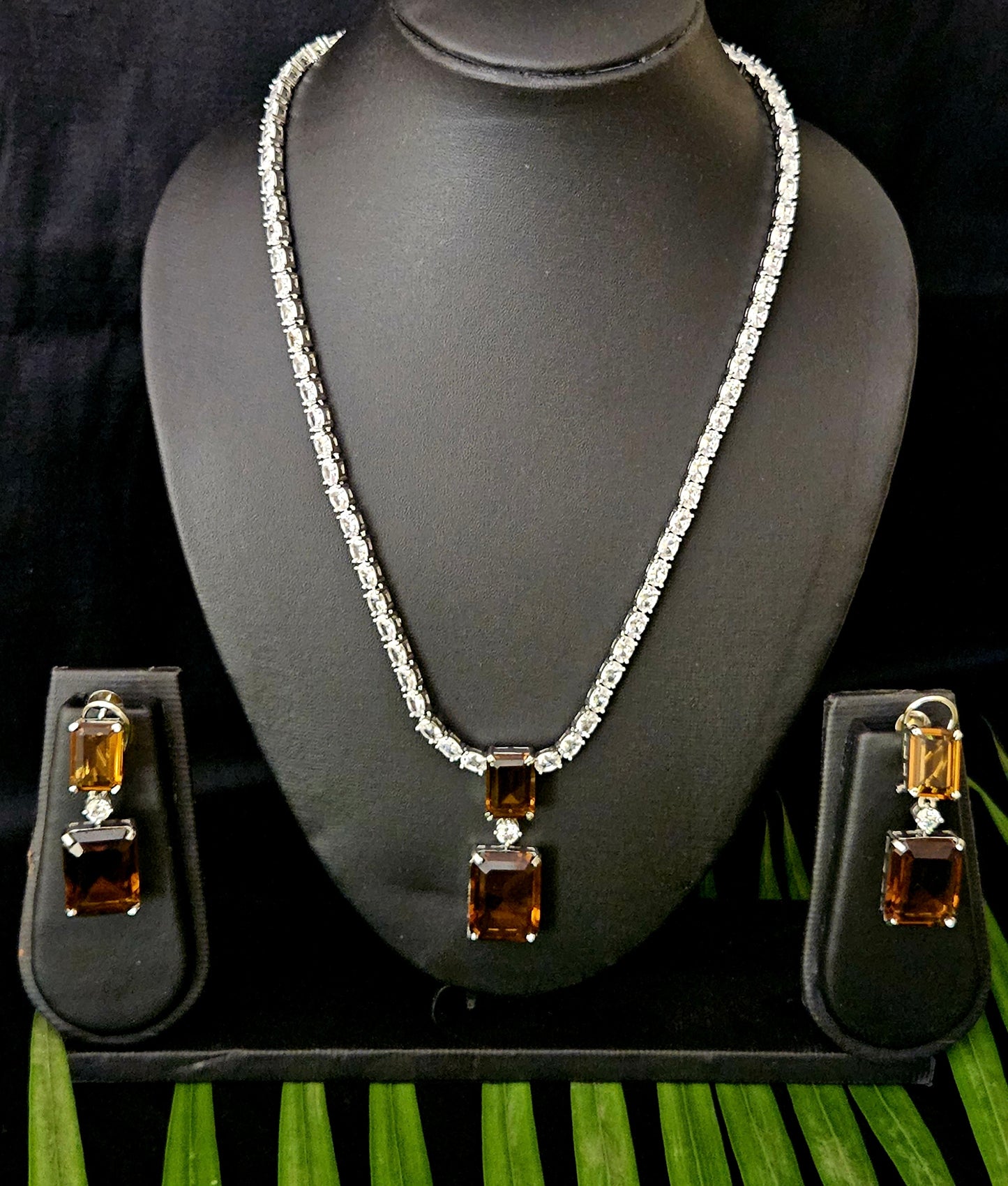 Platinum finish single strand CZ set with dual rectangle topaz/brown stone pendant, matching earrings