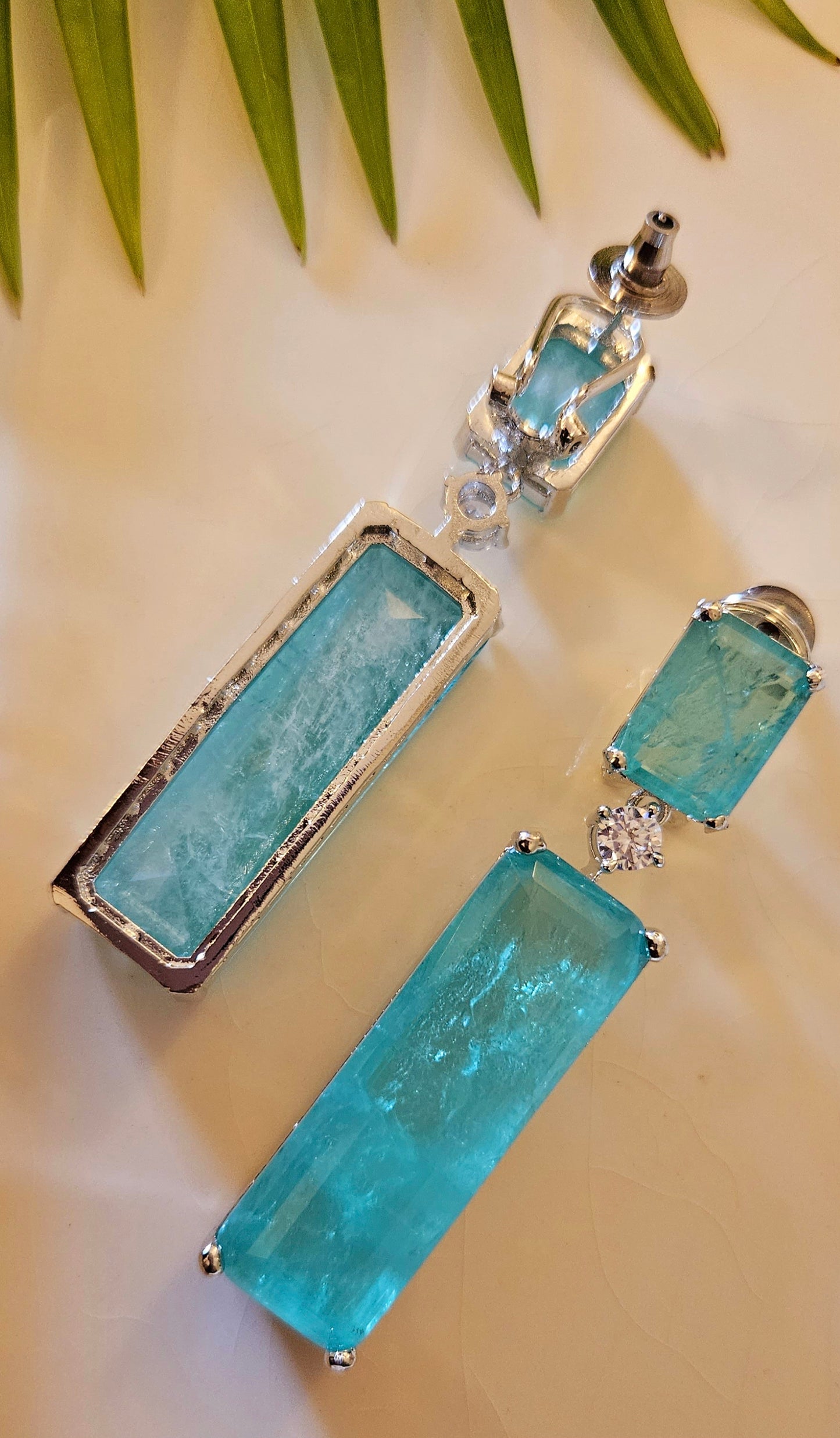 Platinum finish set with long mint green stone pendant in CZ single layer strand, matching earrings