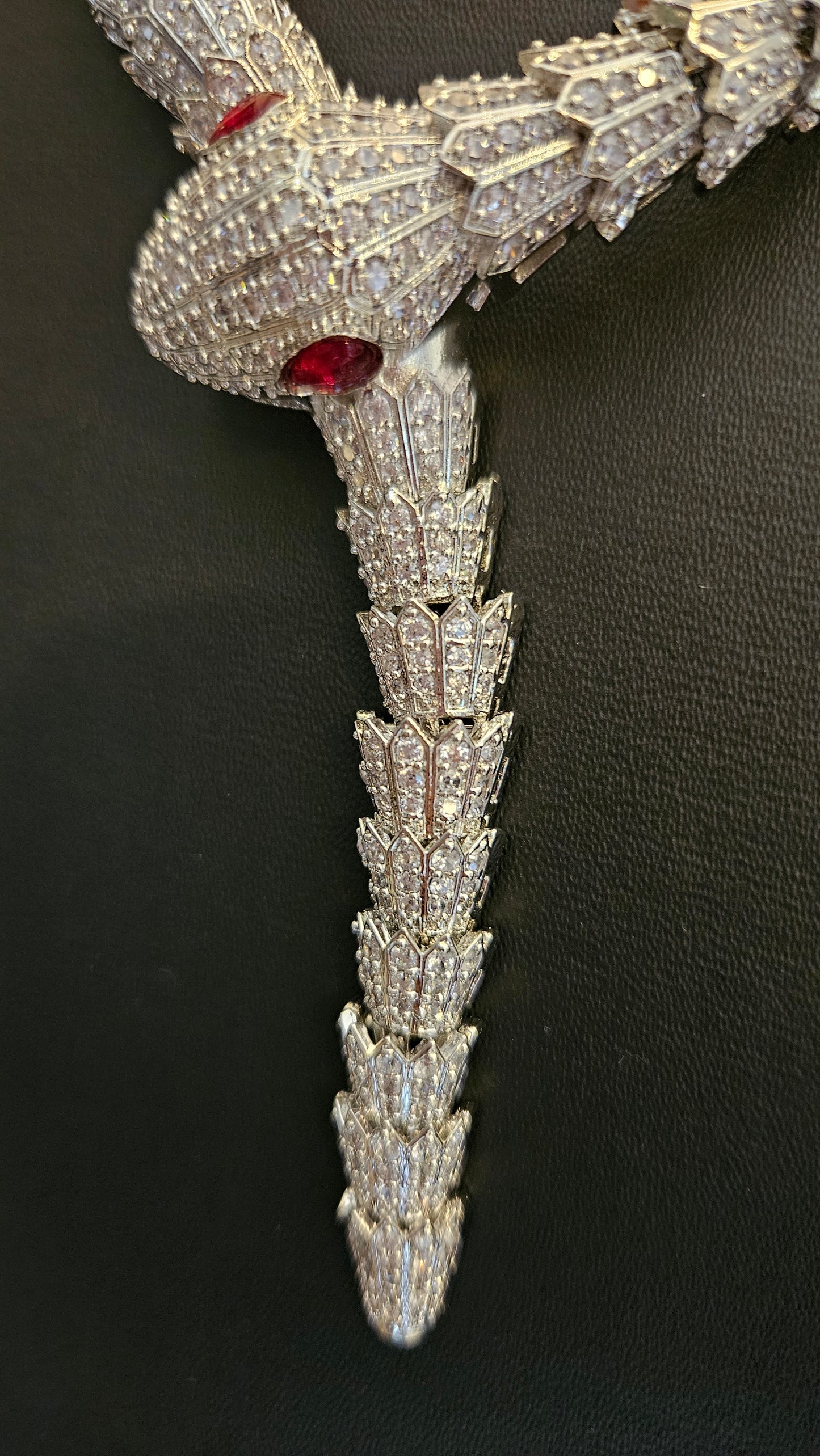 Platinum finish serpent set, necklace has big serpent eye, matching earrings