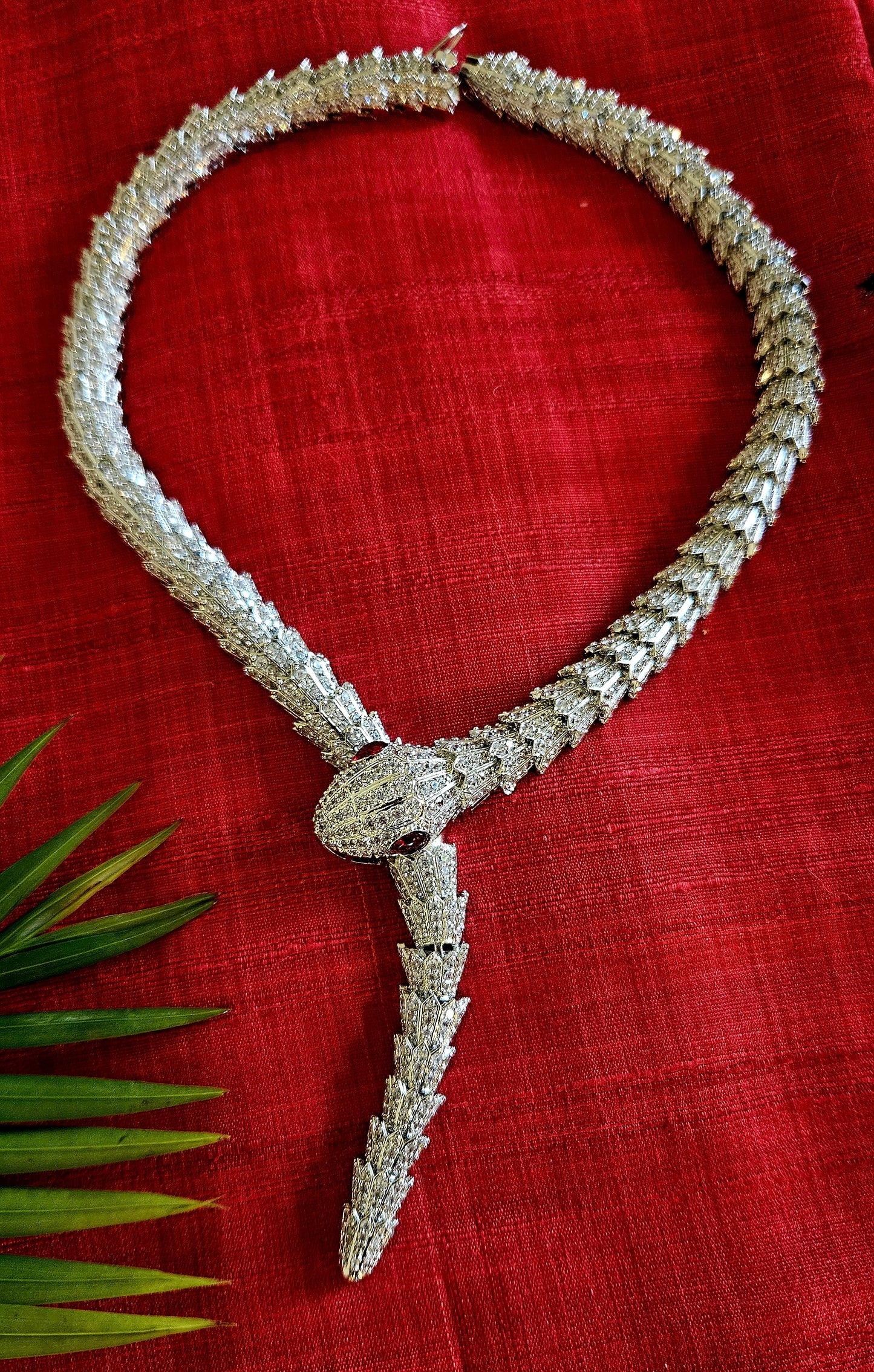 Platinum finish serpent set, necklace has big serpent eye, matching earrings