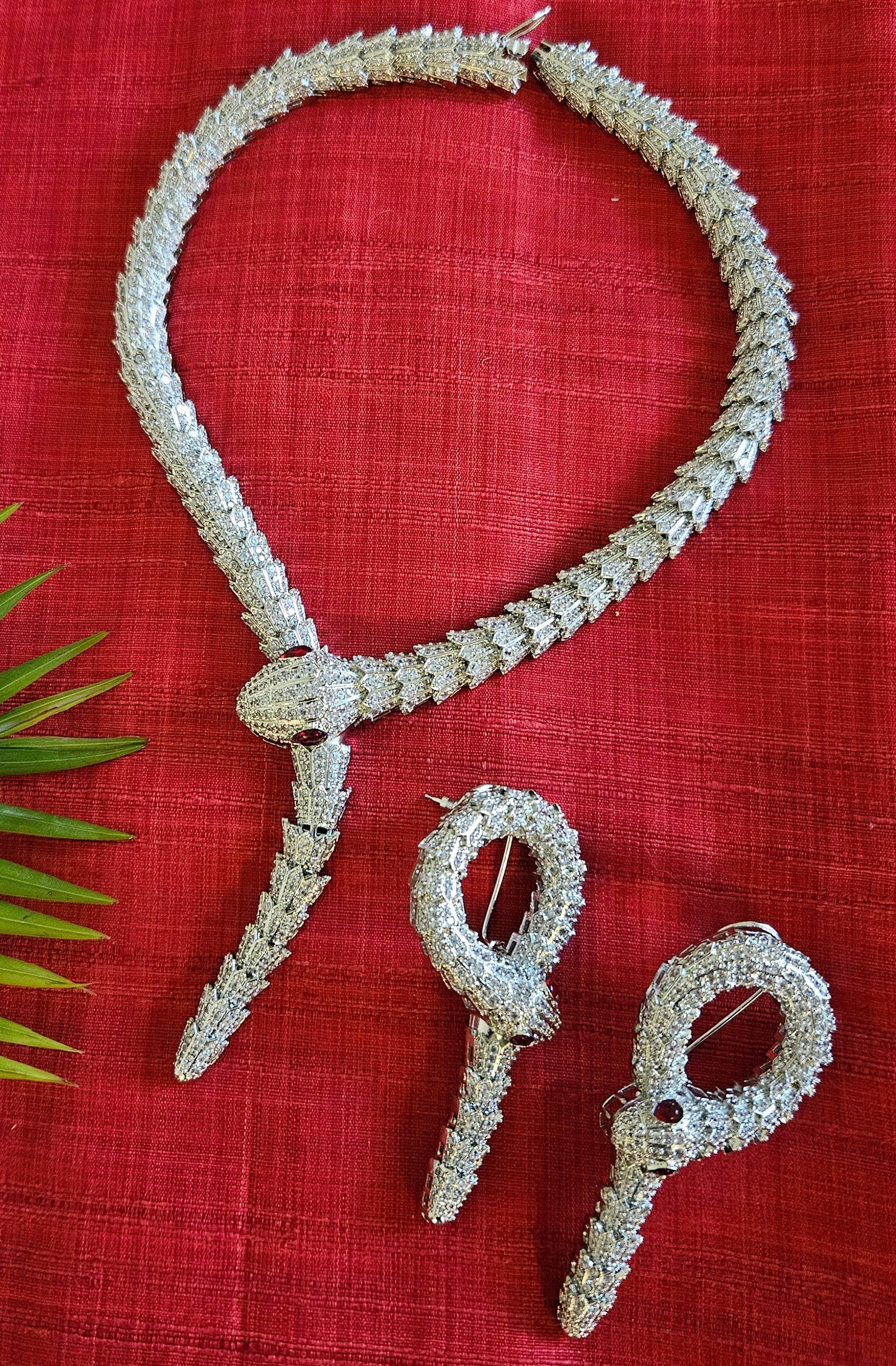 Platinum finish serpent set, necklace has big serpent eye, matching earrings