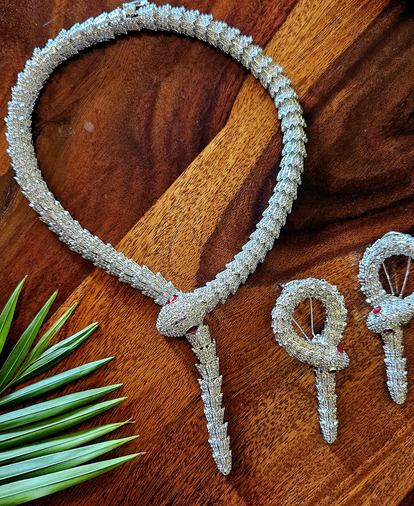 Platinum finish serpent set, necklace has big serpent eye, matching earrings