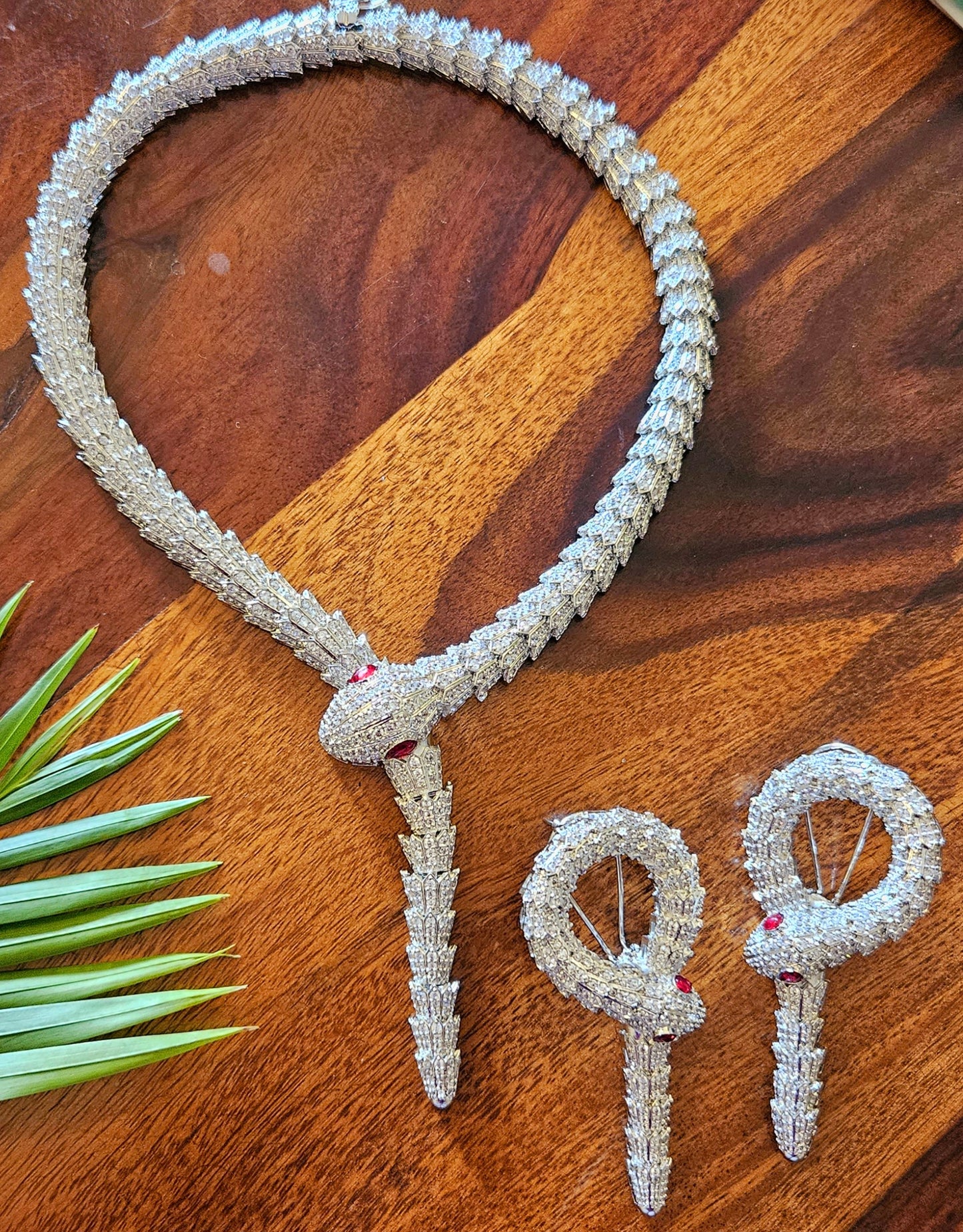 Platinum finish serpent set, necklace has big serpent eye, matching earrings