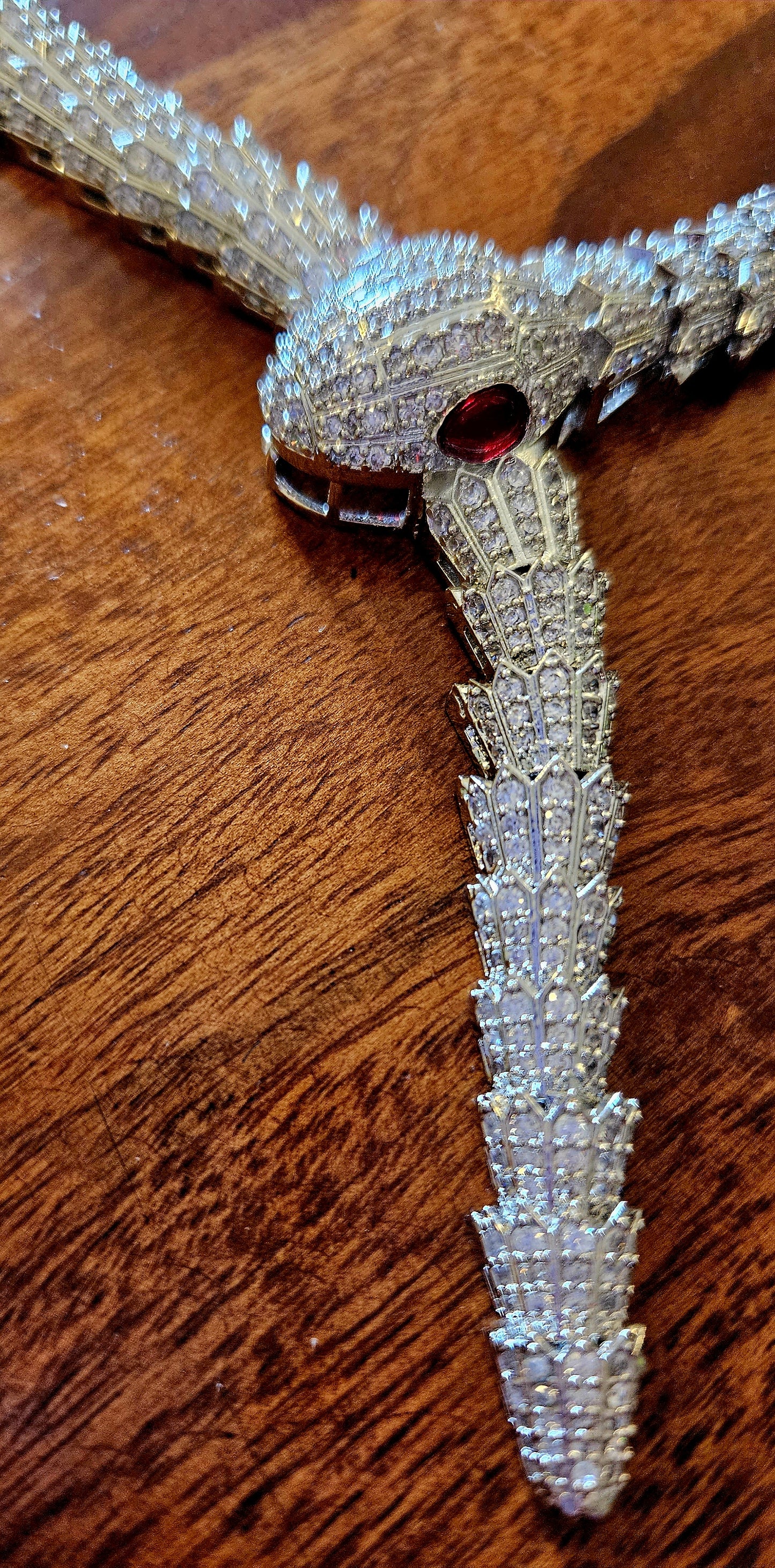 Platinum finish serpent set, necklace has big serpent eye, matching earrings