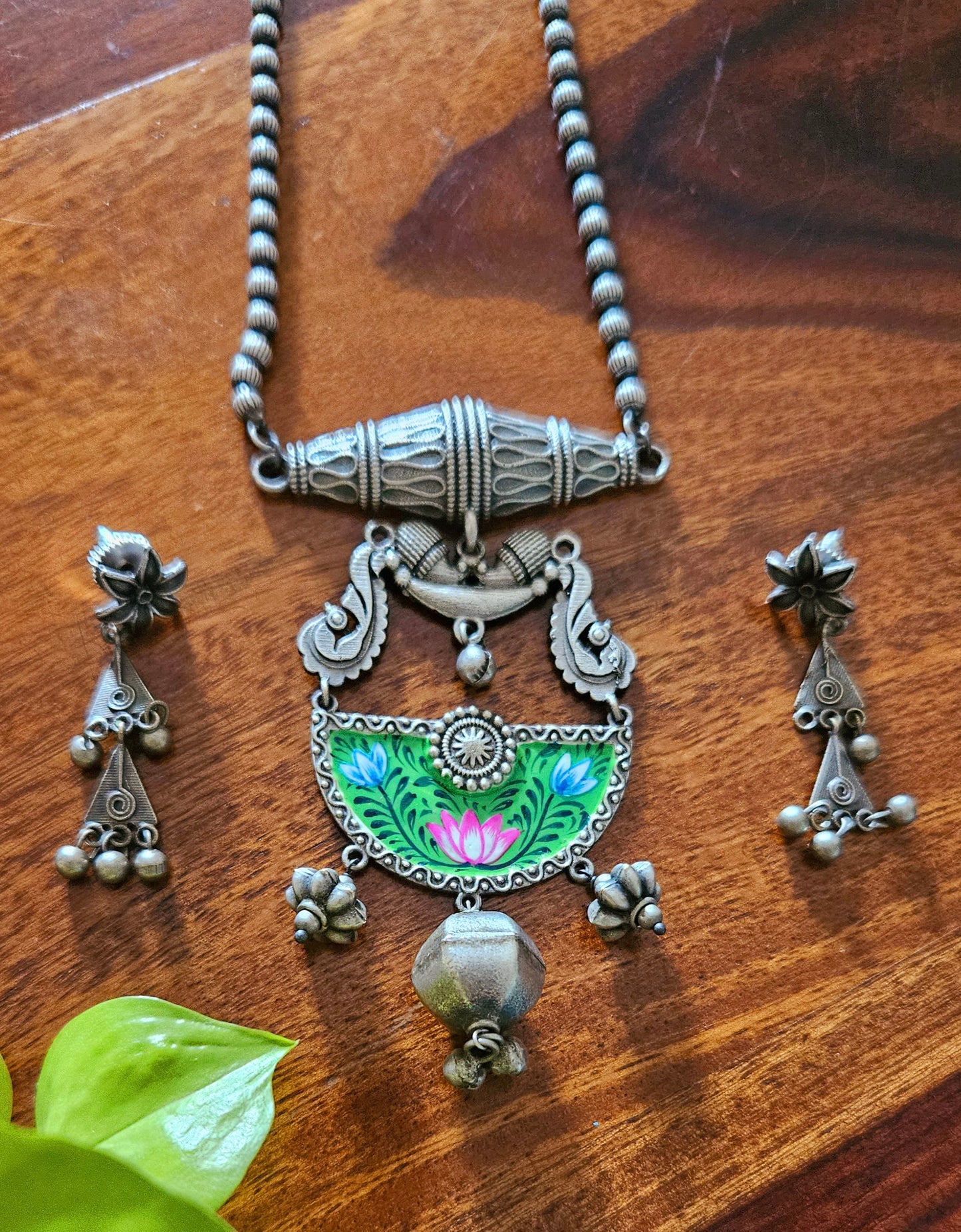 Silver finish long necklace set, green hand-painted pendant with metal globe hanging and damroo held on metal bead chain, matching earrings