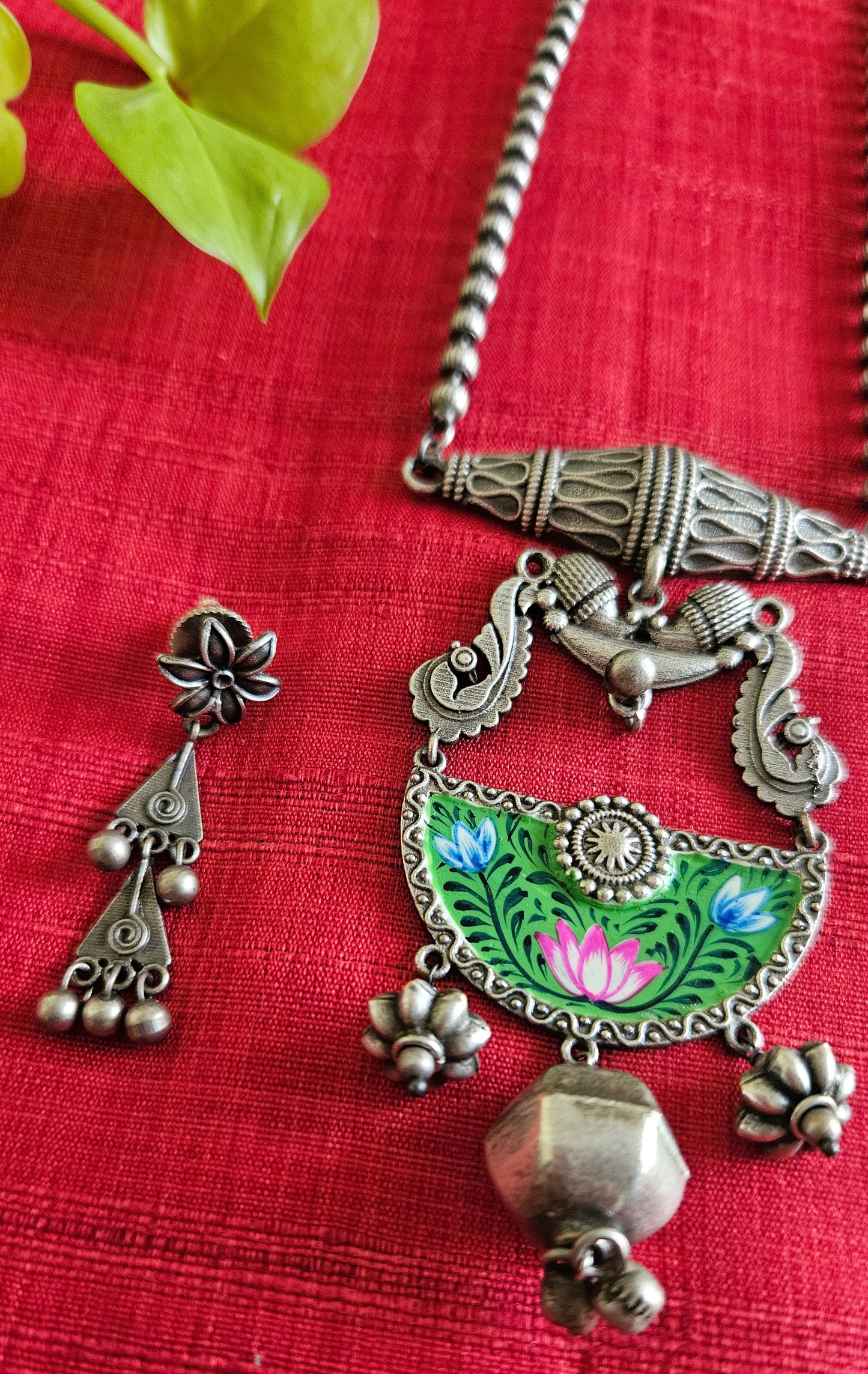 Silver finish long necklace set, green hand-painted pendant with metal globe hanging and damroo held on metal bead chain, matching earrings