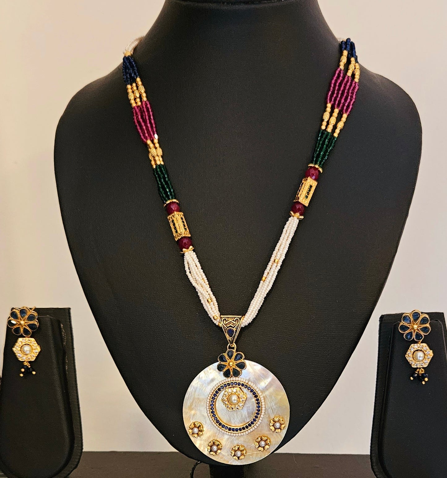 Pearl Pendant set with work of blue/red stone in multiple strands on pearl, blue and red stone, matching earrings