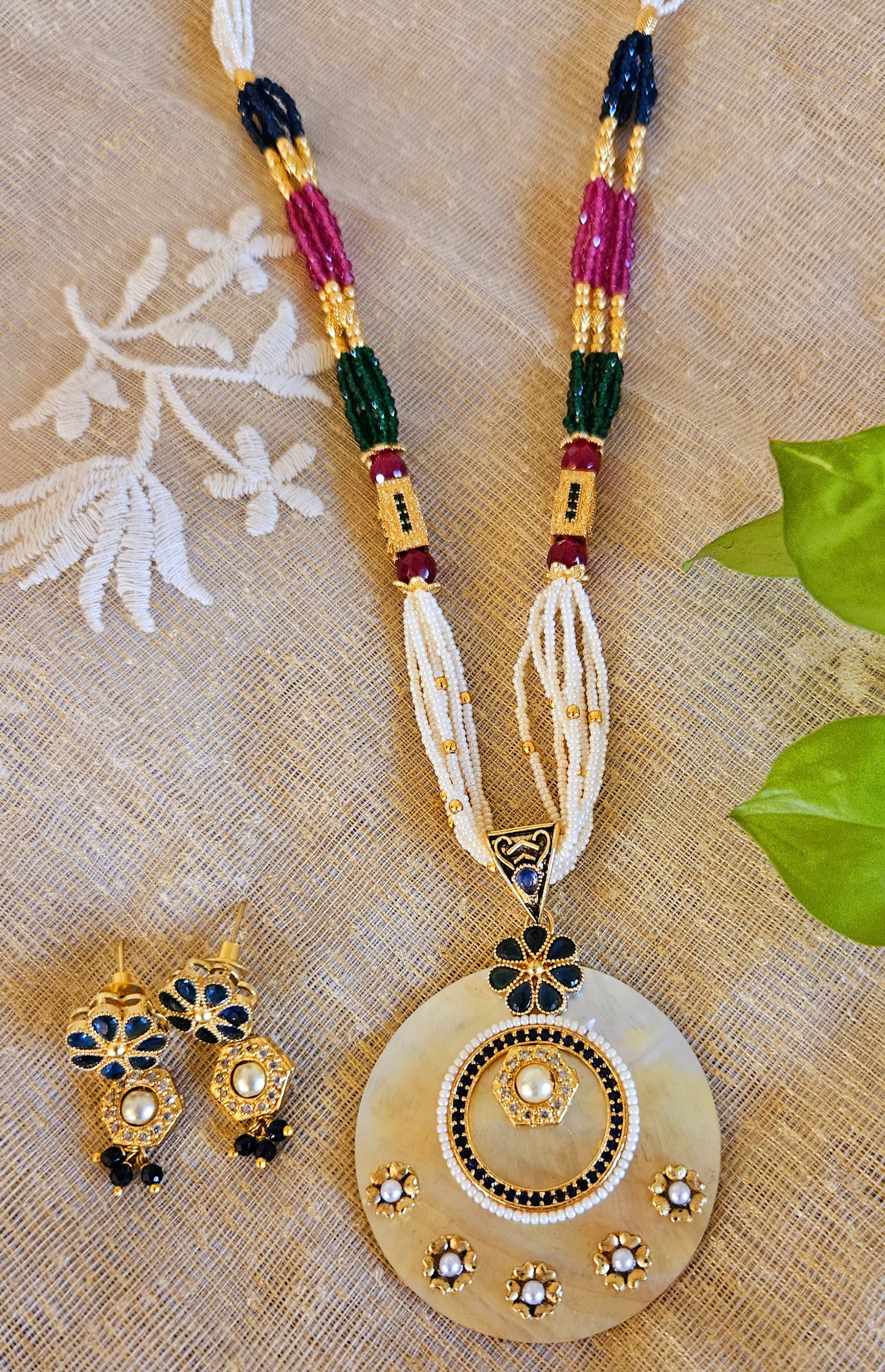 Pearl Pendant set with work of blue/red stone in multiple strands on pearl, blue and red stone, matching earrings