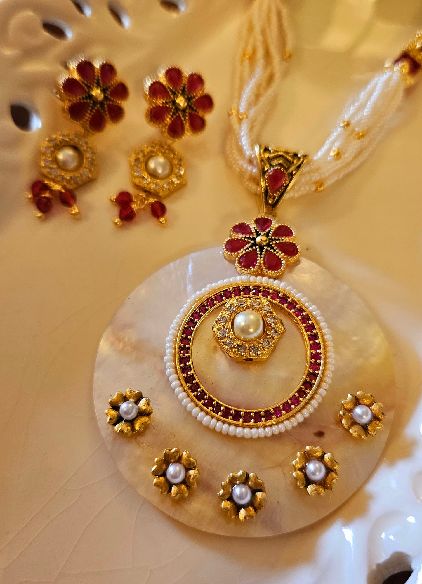 Pearl Pendant set with work of blue/red stone in multiple strands on pearl, blue and red stone, matching earrings