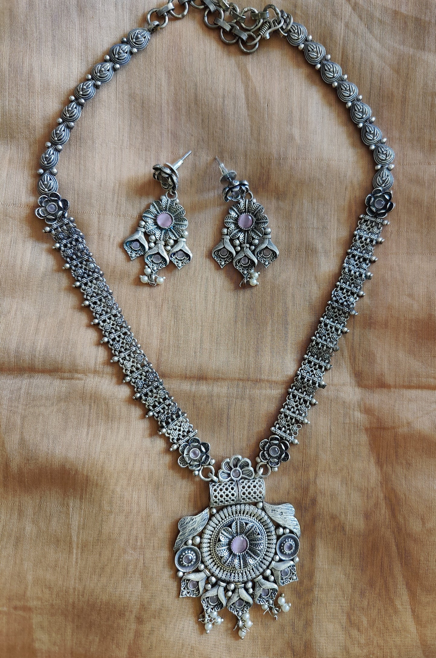 Floral motif long necklace and earrings set in silver finish