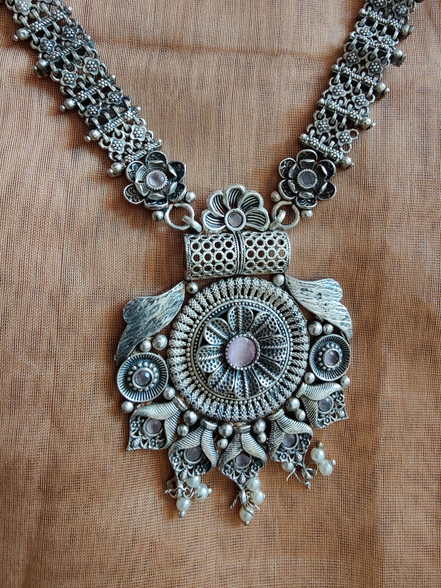 Floral motif long necklace and earrings set in silver finish