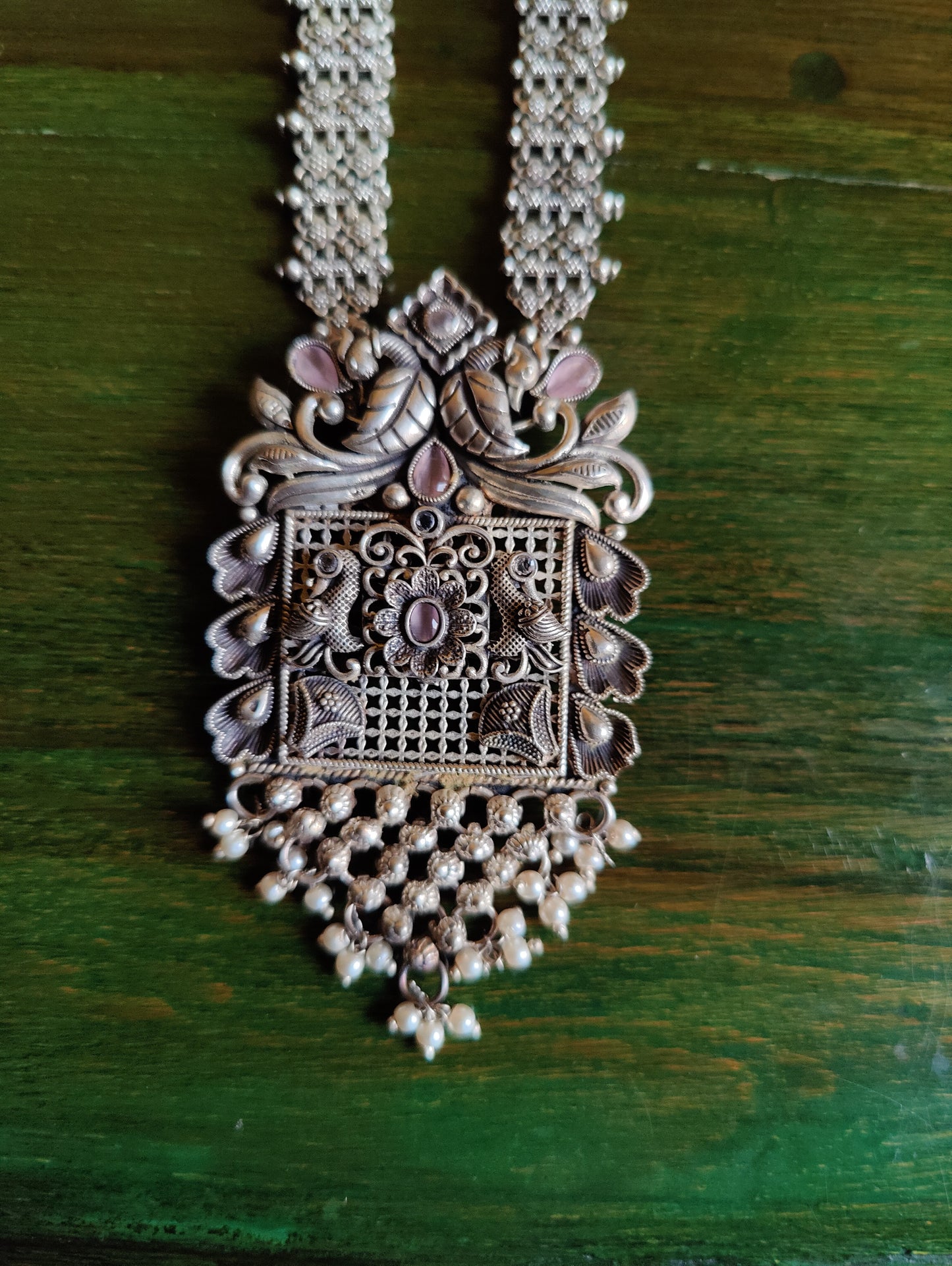 Silver finish set, long necklace with intricate work and pale pink/mint green detailing, matching earrings