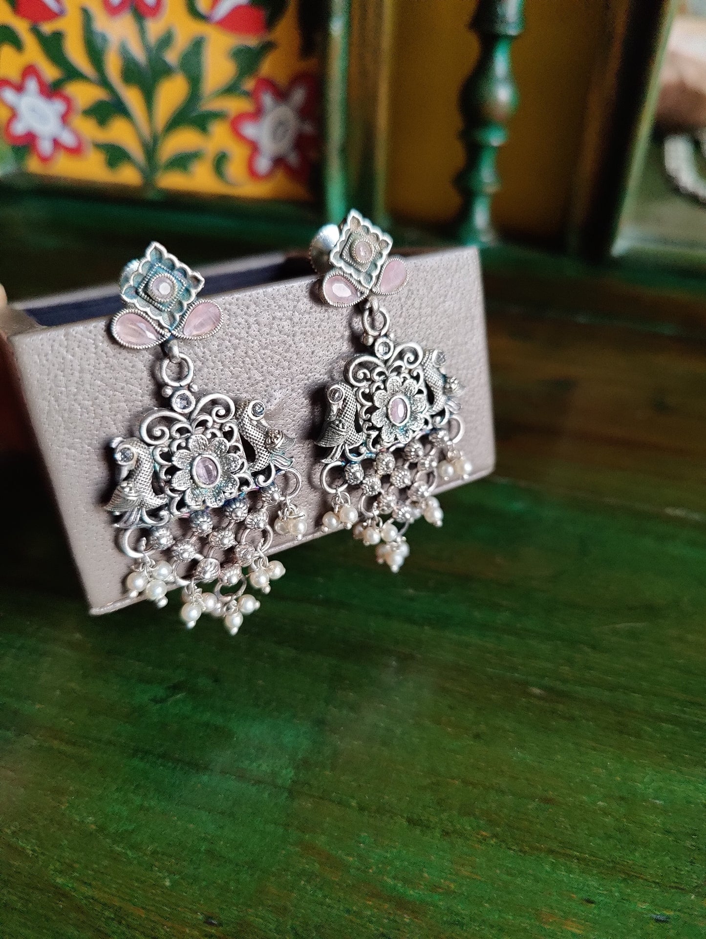 Silver finish set, long necklace with intricate work and pale pink/mint green detailing, matching earrings