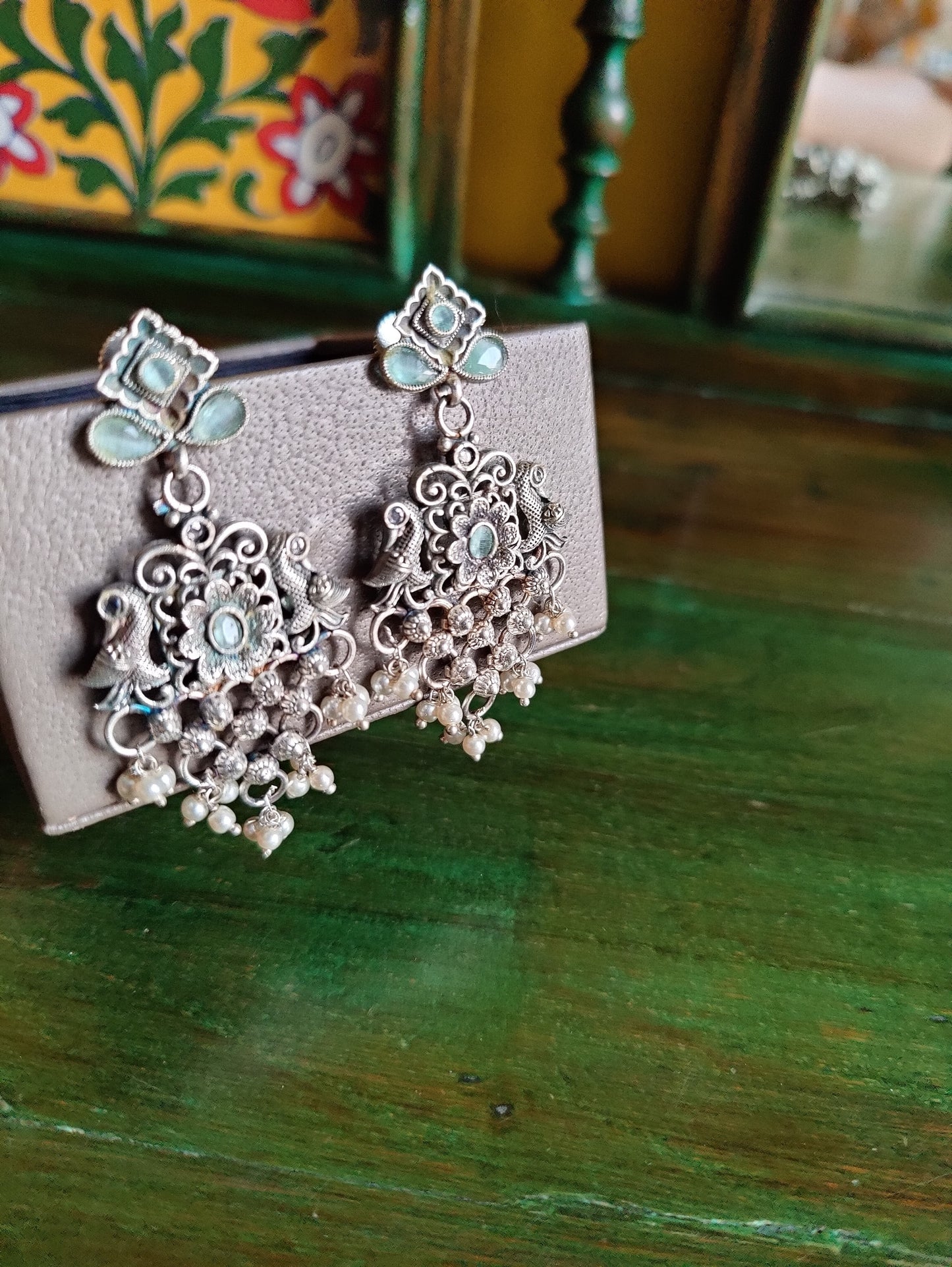 Silver finish set, long necklace with intricate work and pale pink/mint green detailing, matching earrings