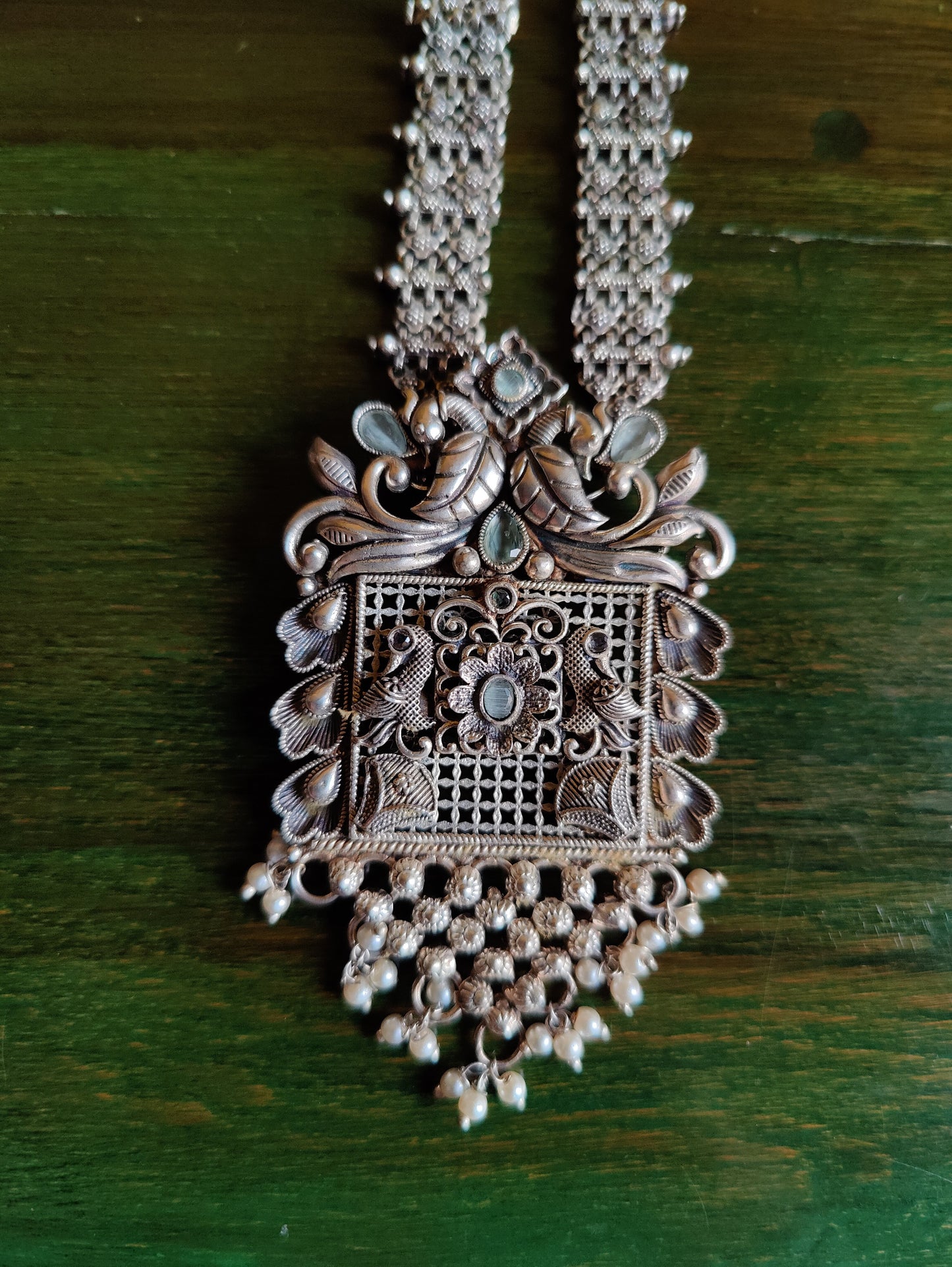 Silver finish set, long necklace with intricate work and pale pink/mint green detailing, matching earrings