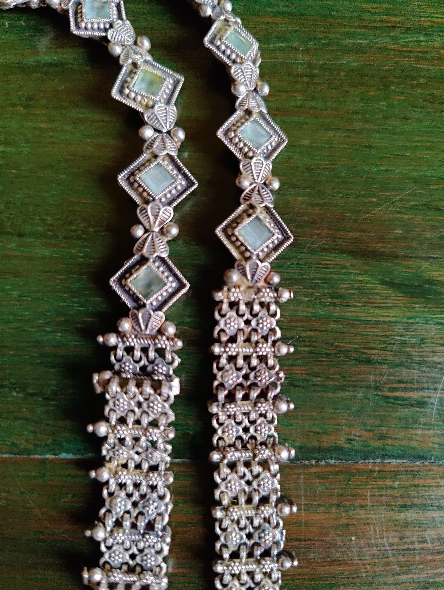 Silver finish set, long necklace with intricate work and pale pink/mint green detailing, matching earrings