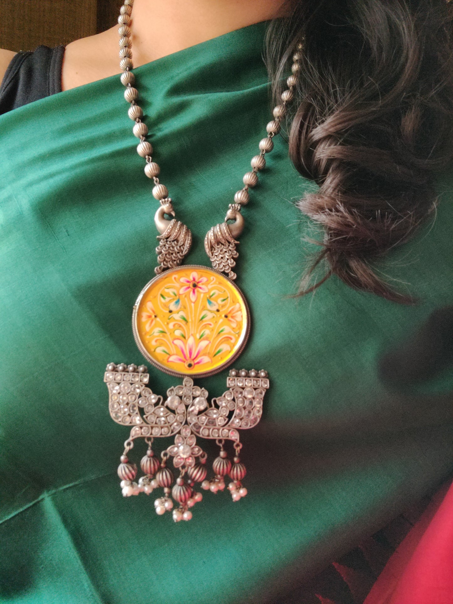 Silver finish hand-painted set with big yellow pendant and peacock motif , matching earrings