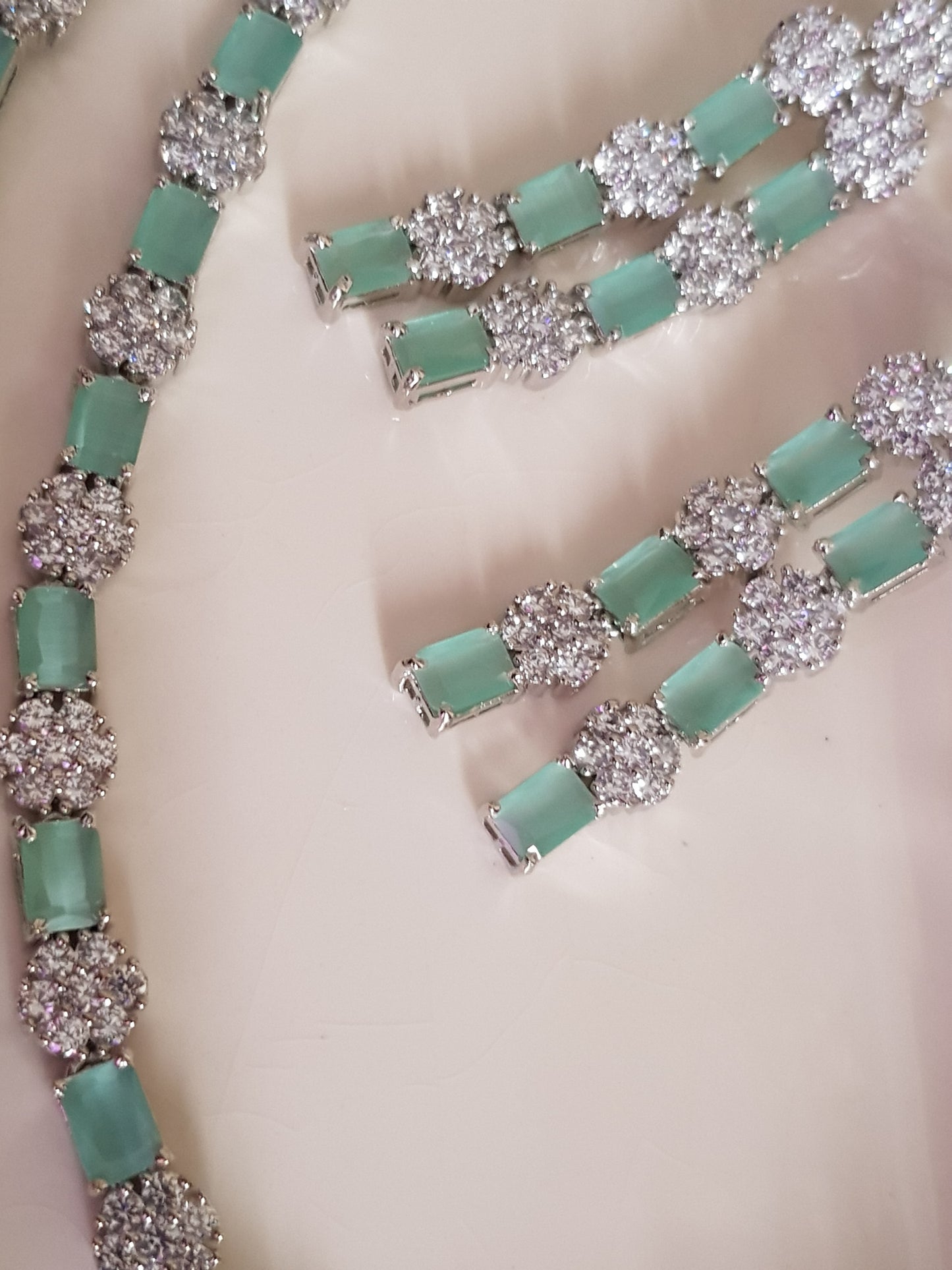 Platinum finish set,dual layered necklace with mint green stone and CZ flower,matching danglers (earrings)