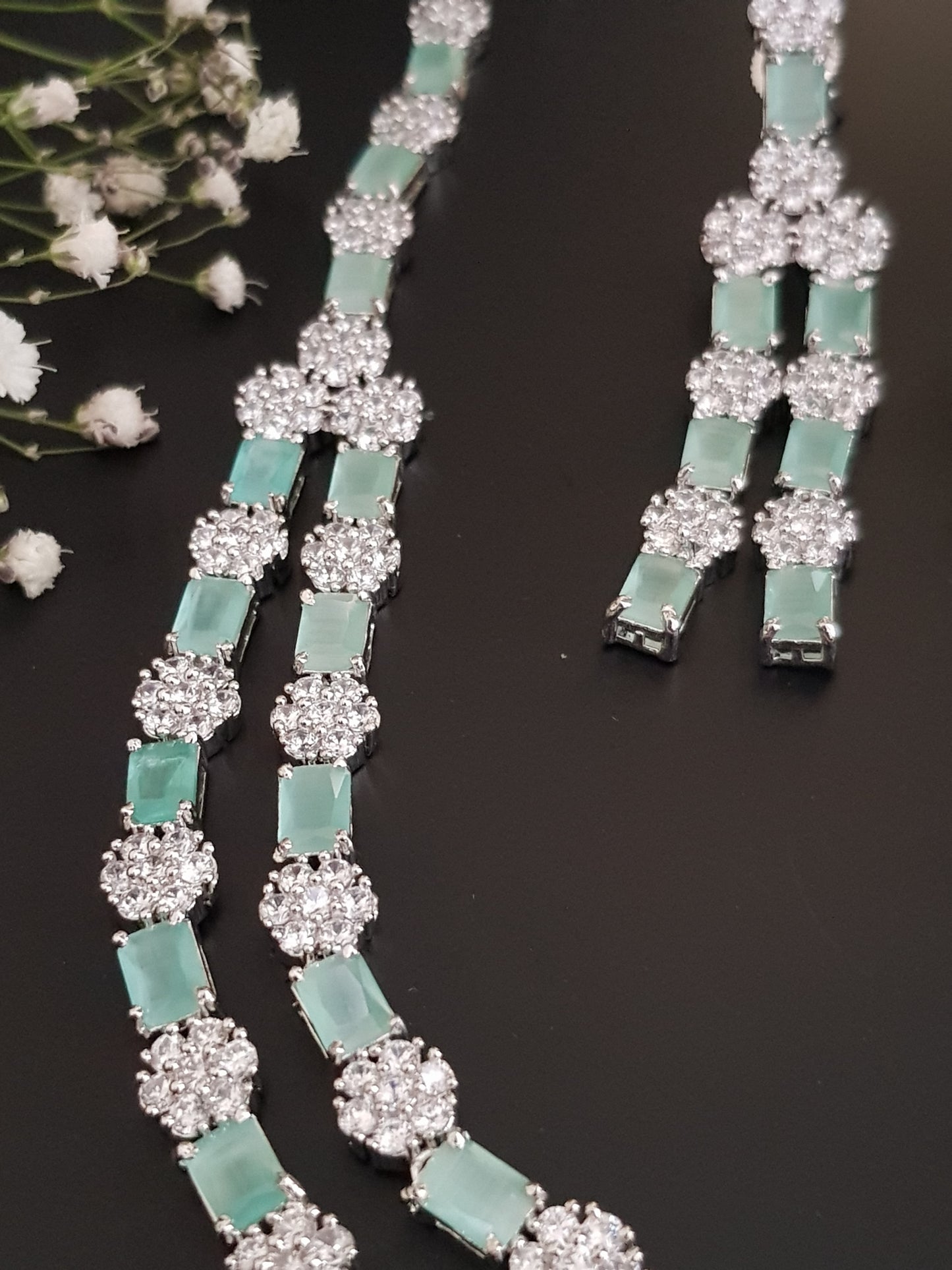 Platinum finish set,dual layered necklace with mint green stone and CZ flower,matching danglers (earrings)