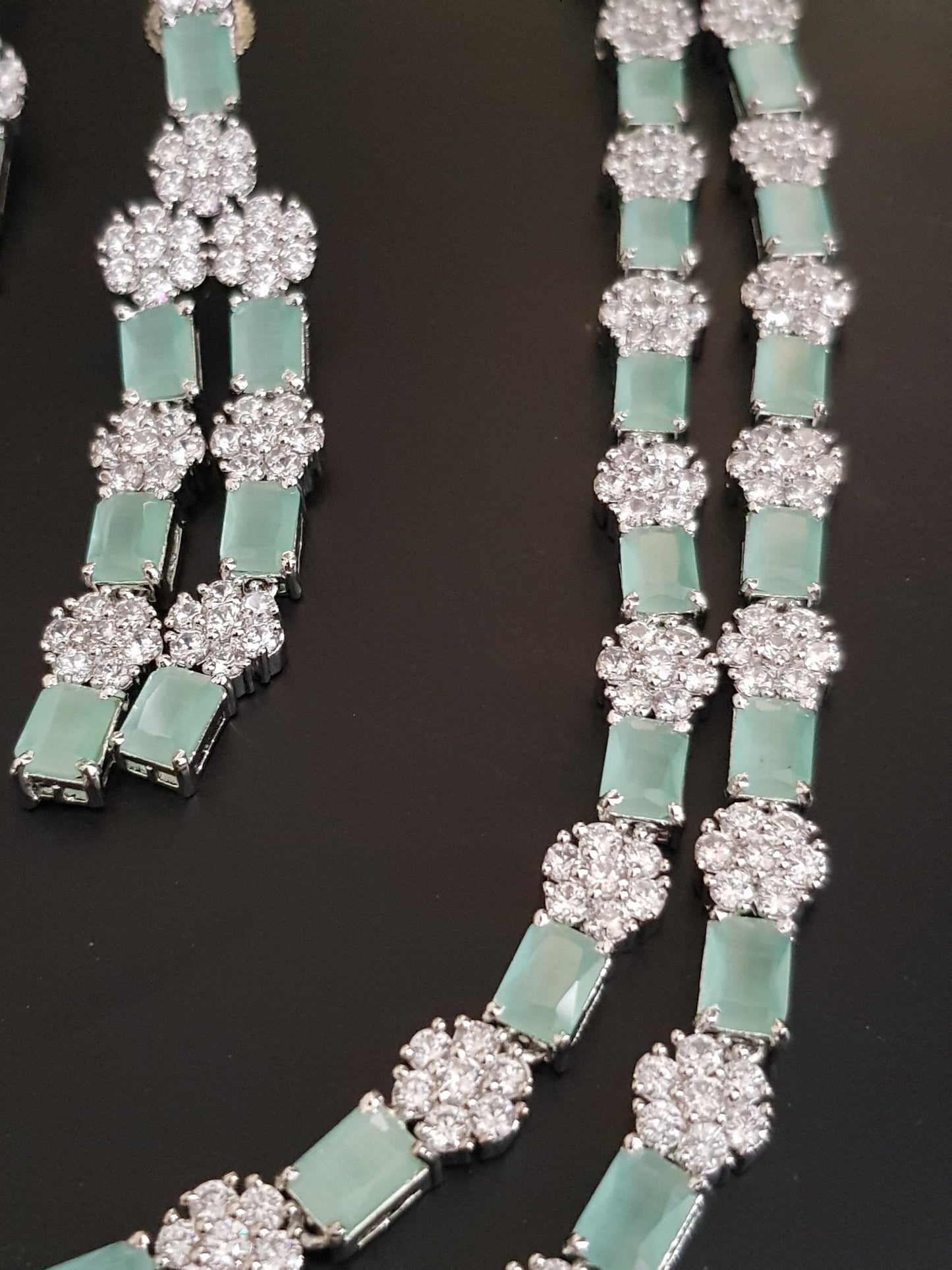 Platinum finish set,dual layered necklace with mint green stone and CZ flower,matching danglers (earrings)