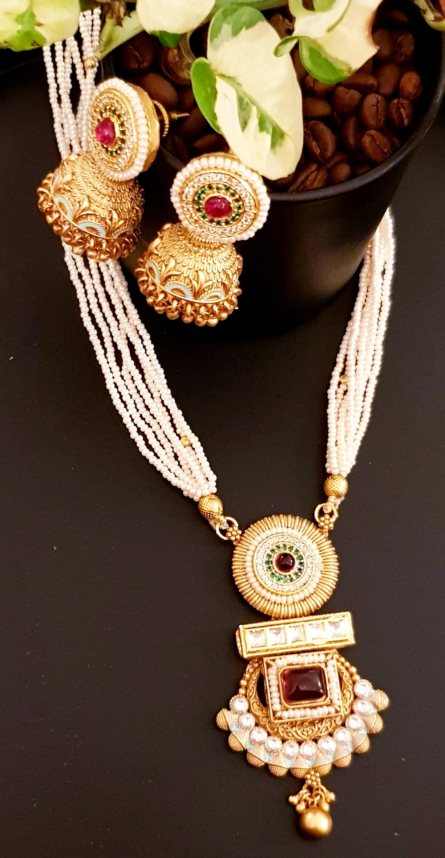 Gold finish set with stone,meenakari and kundan pendant in poth pearl strings with stunning matching jhumkis (earrings)